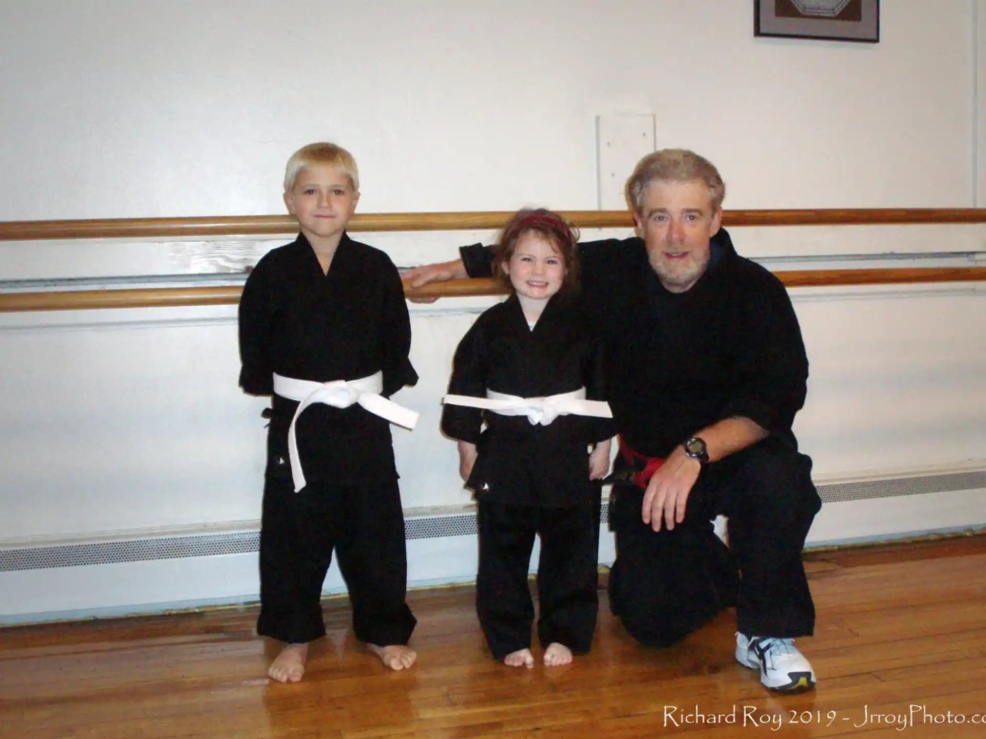 a man and two children posing for a photo