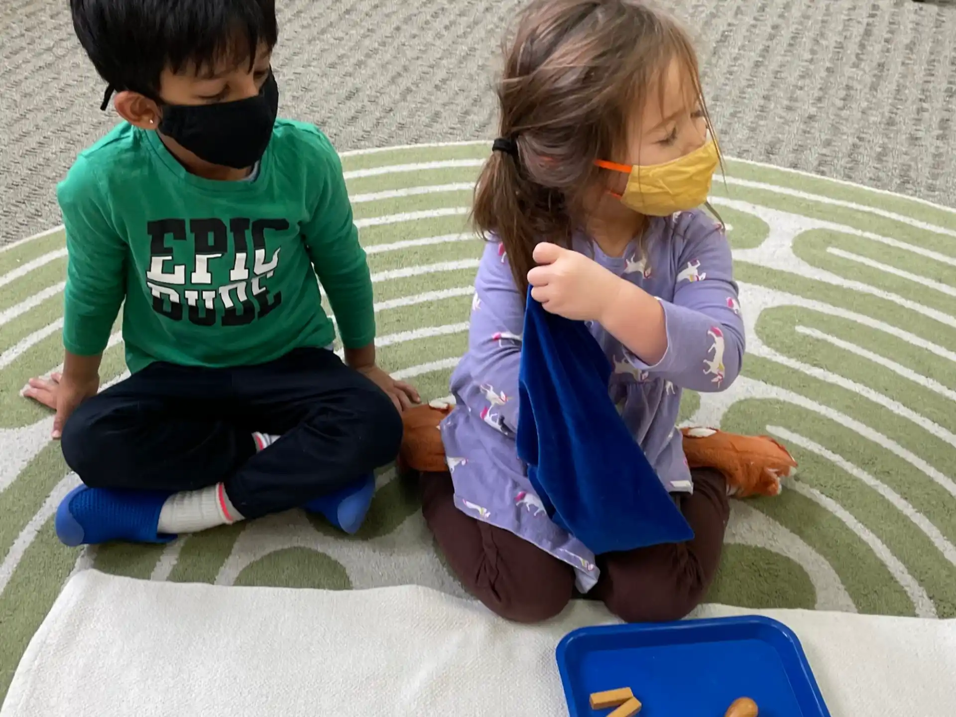 a couple of children playing with toys