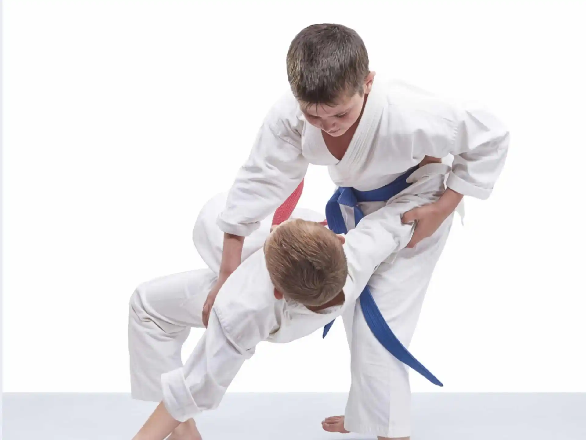 a man and a boy in karate uniforms