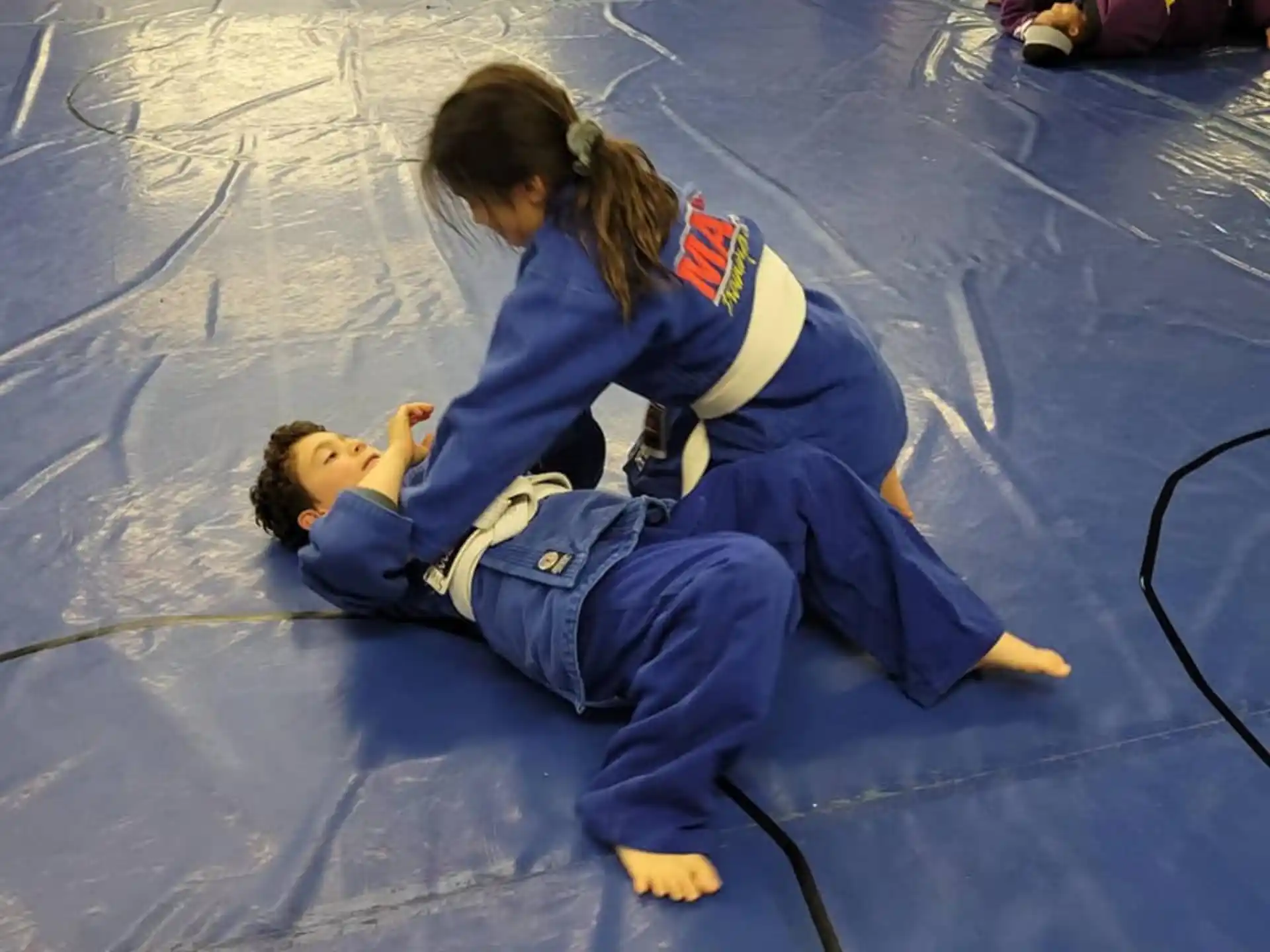 a person and a child on a tile floor