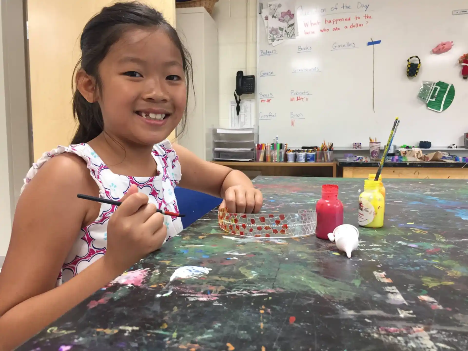 a young girl painting