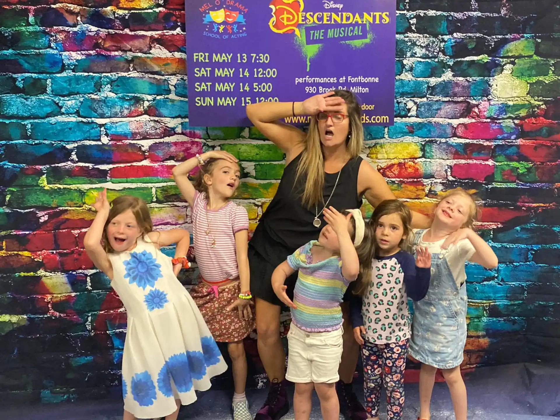 a group of children posing for a photo