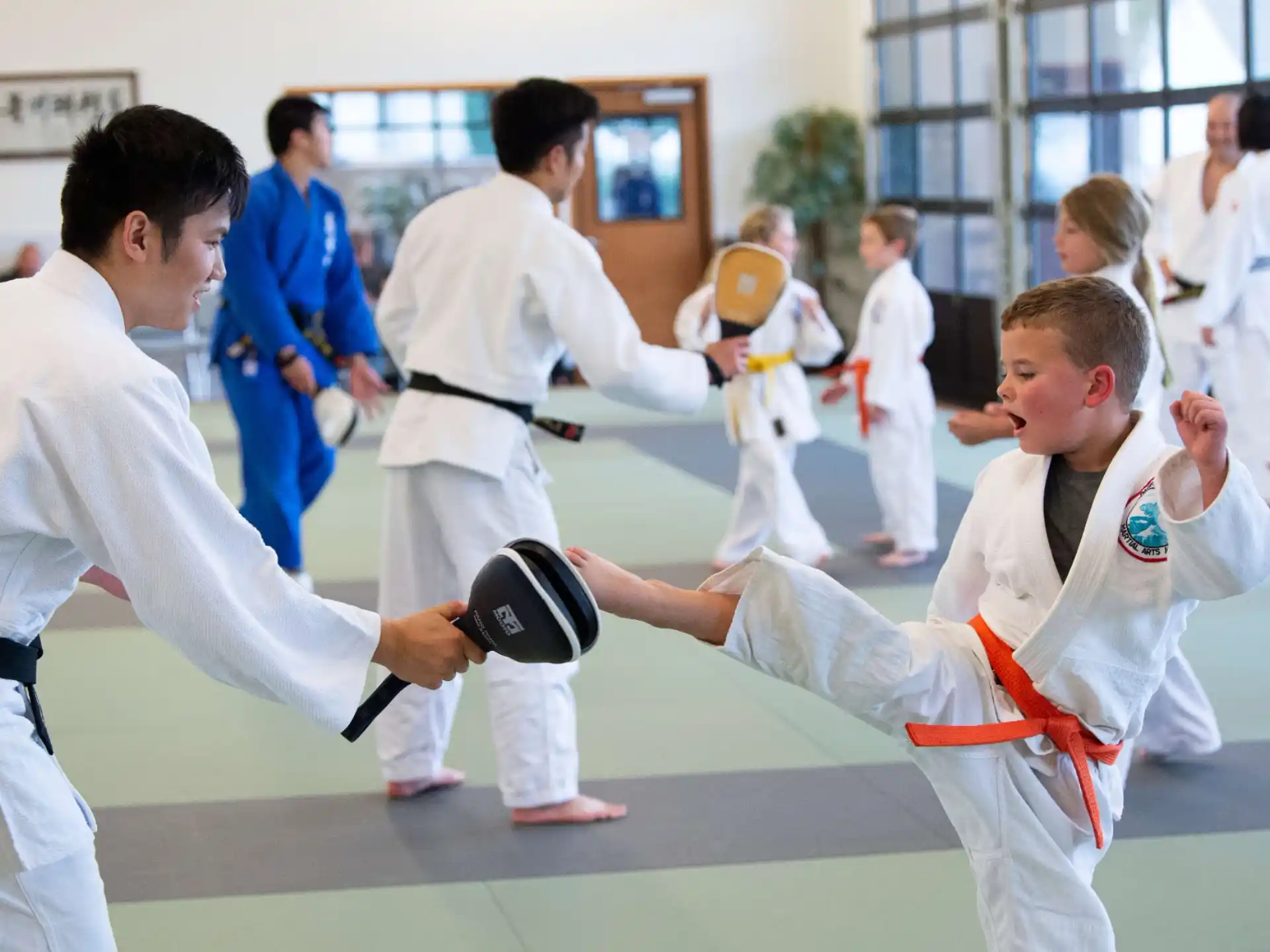 a group of people in karate uniforms