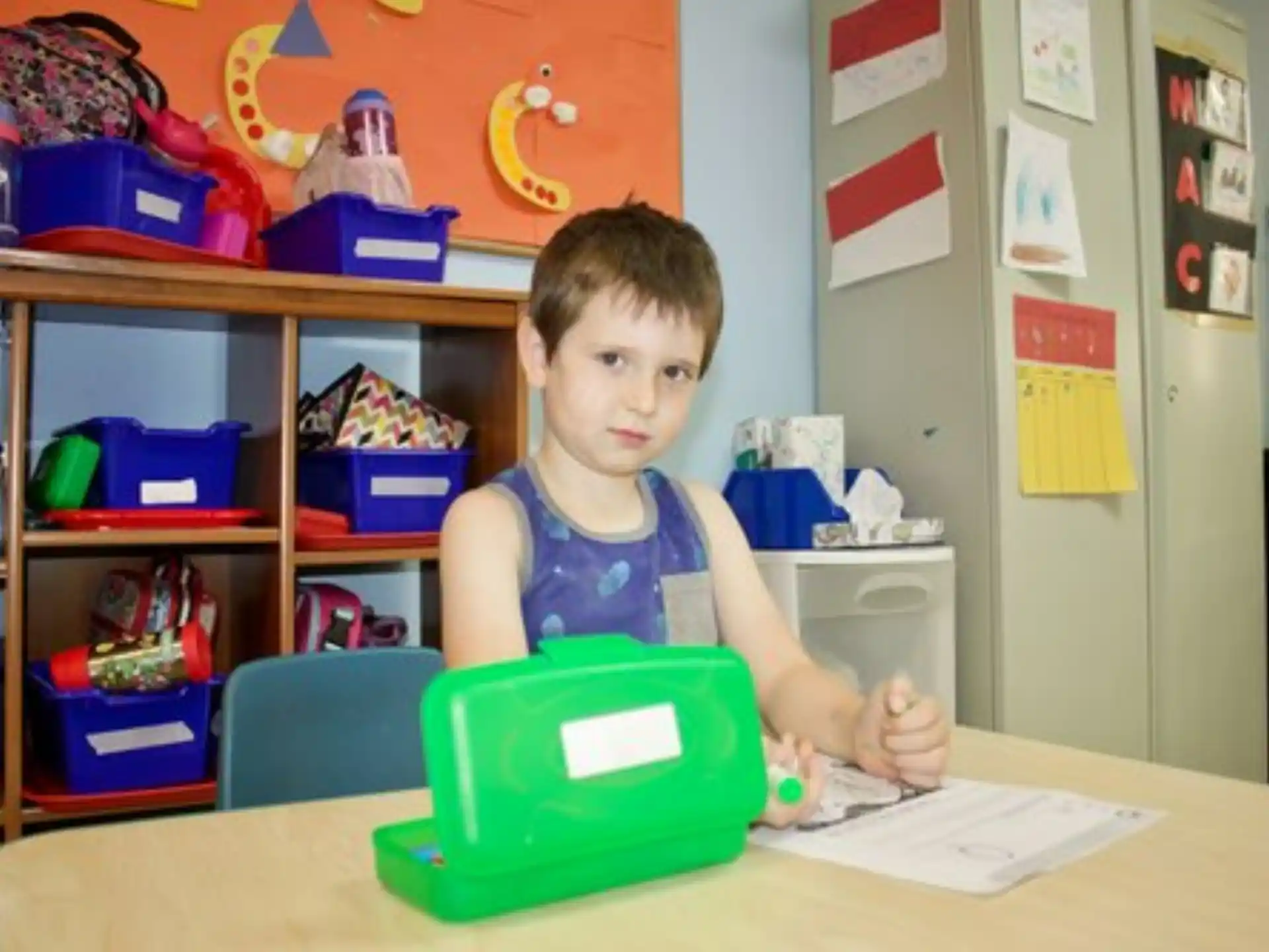 a boy sitting at a table