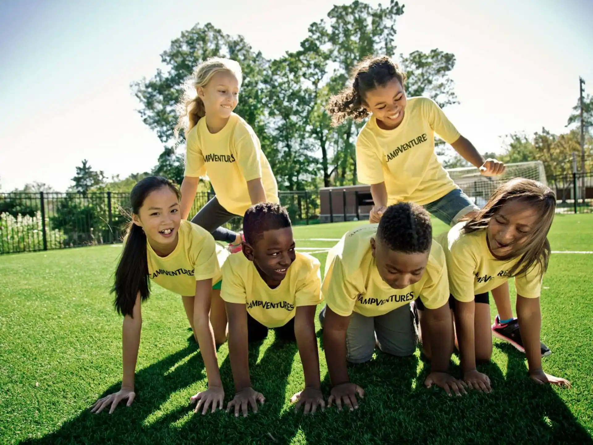 a group of people in yellow shirts