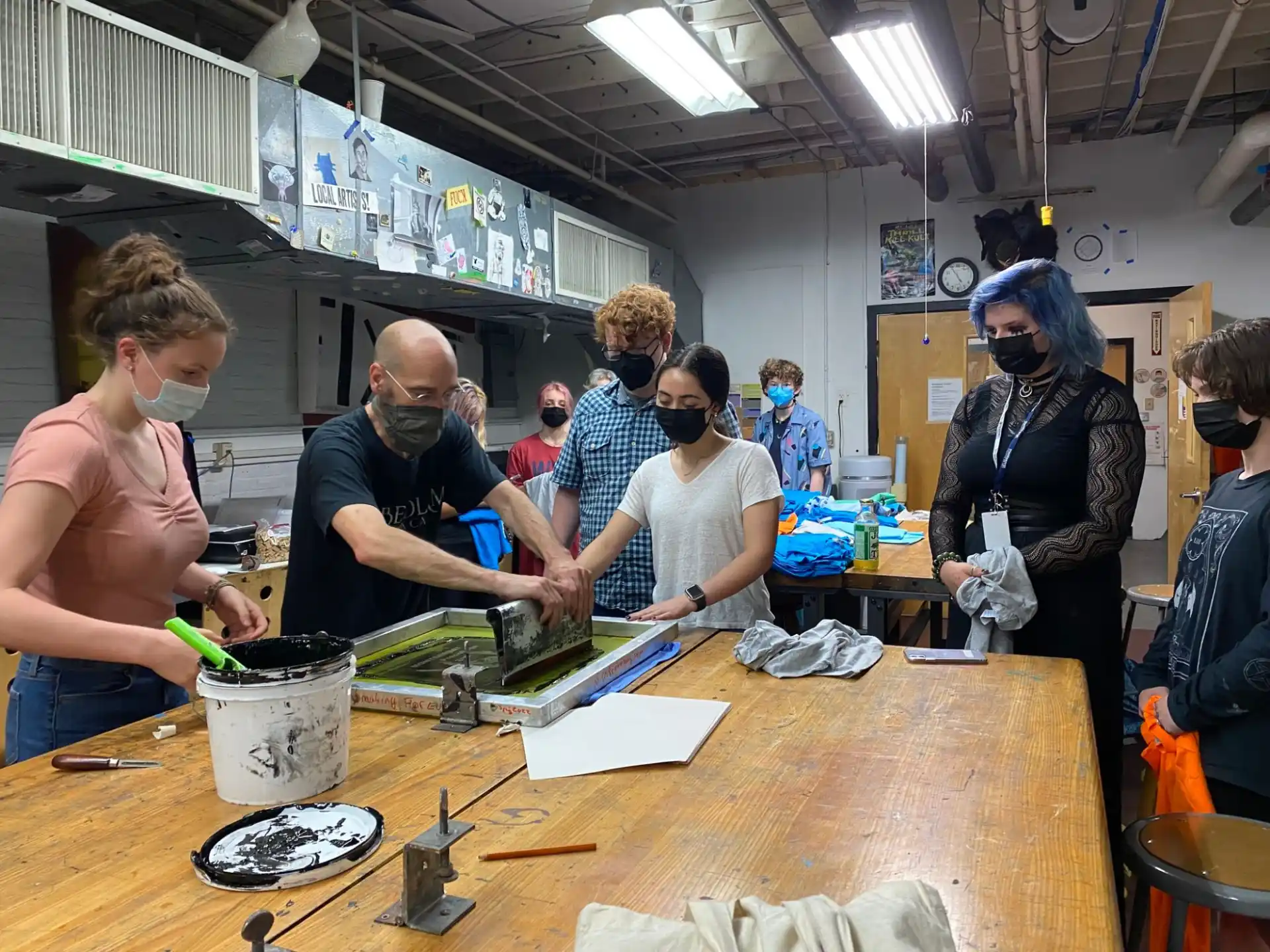 a group of people working in a workshop