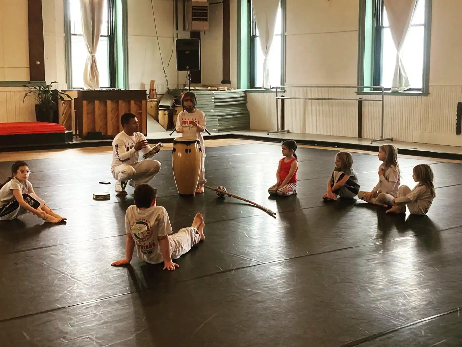 a group of people sitting on the floor