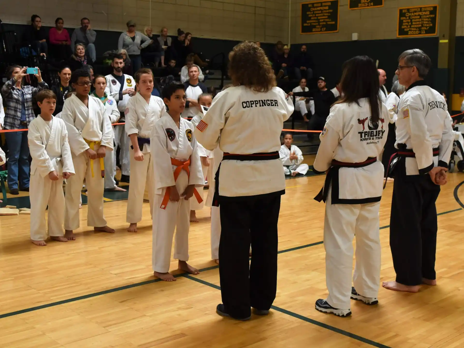 a group of people in karate uniforms
