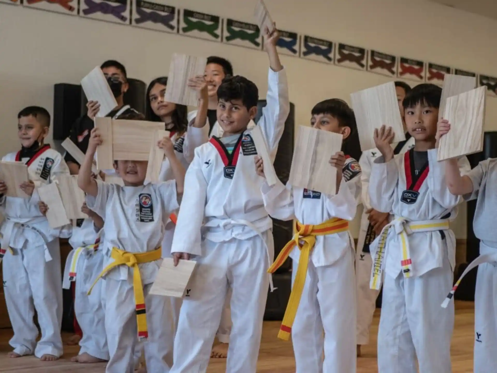 a group of people in karate uniforms