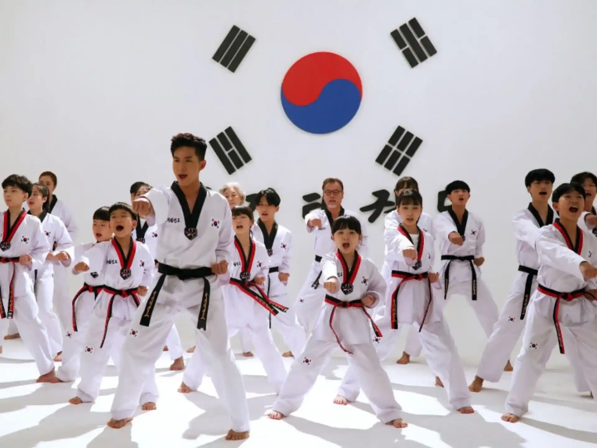 a group of people in karate uniforms