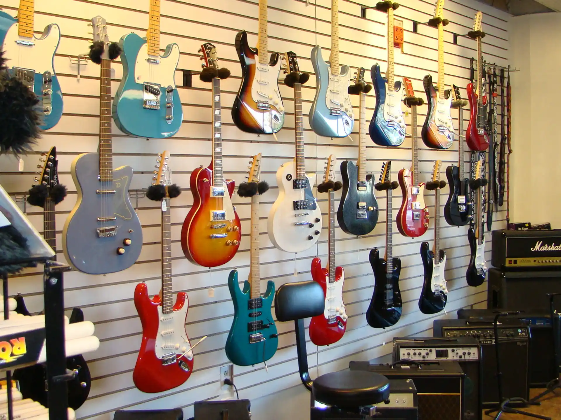 a wall with guitars on it