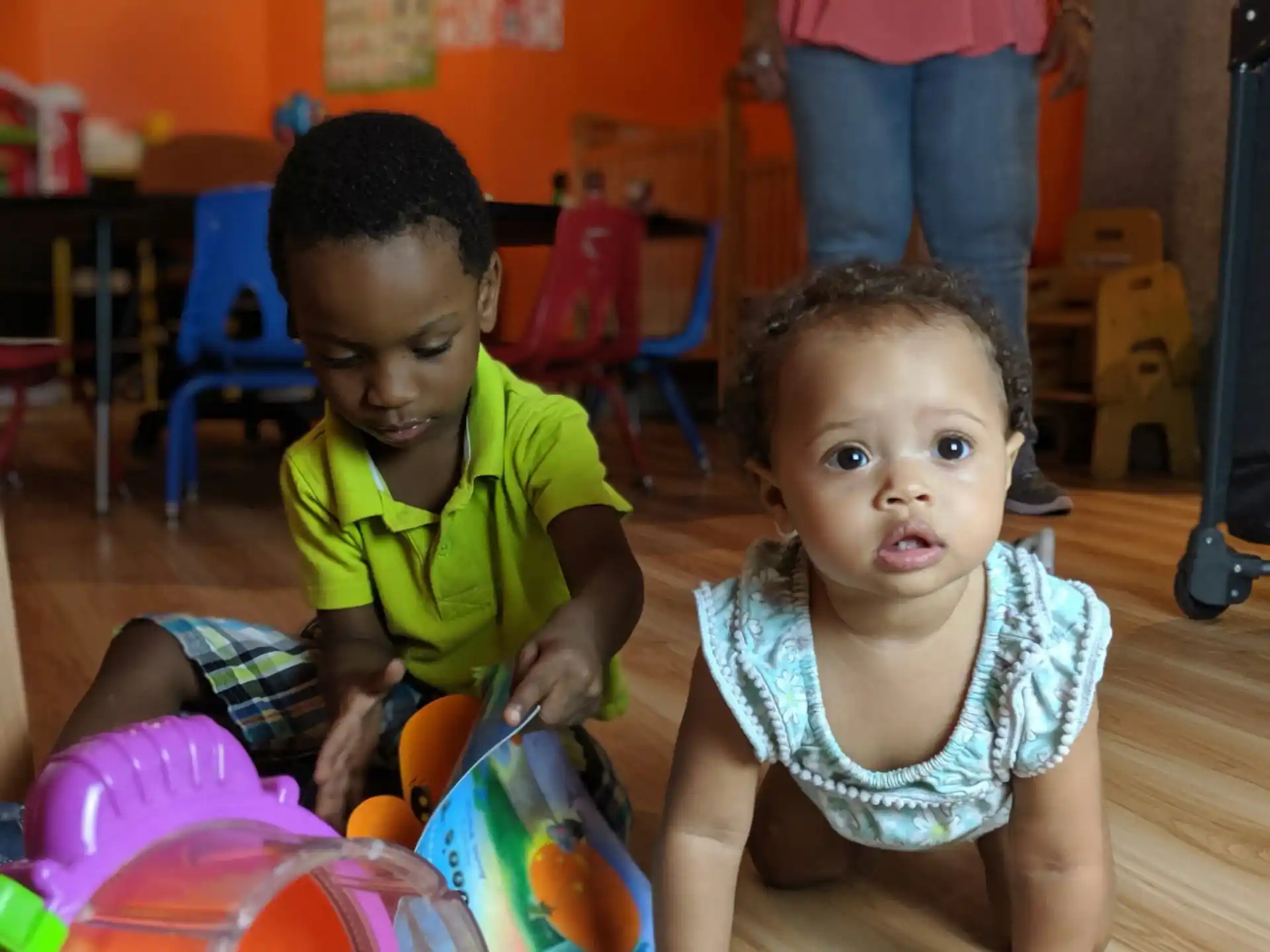 a couple of children playing with toys