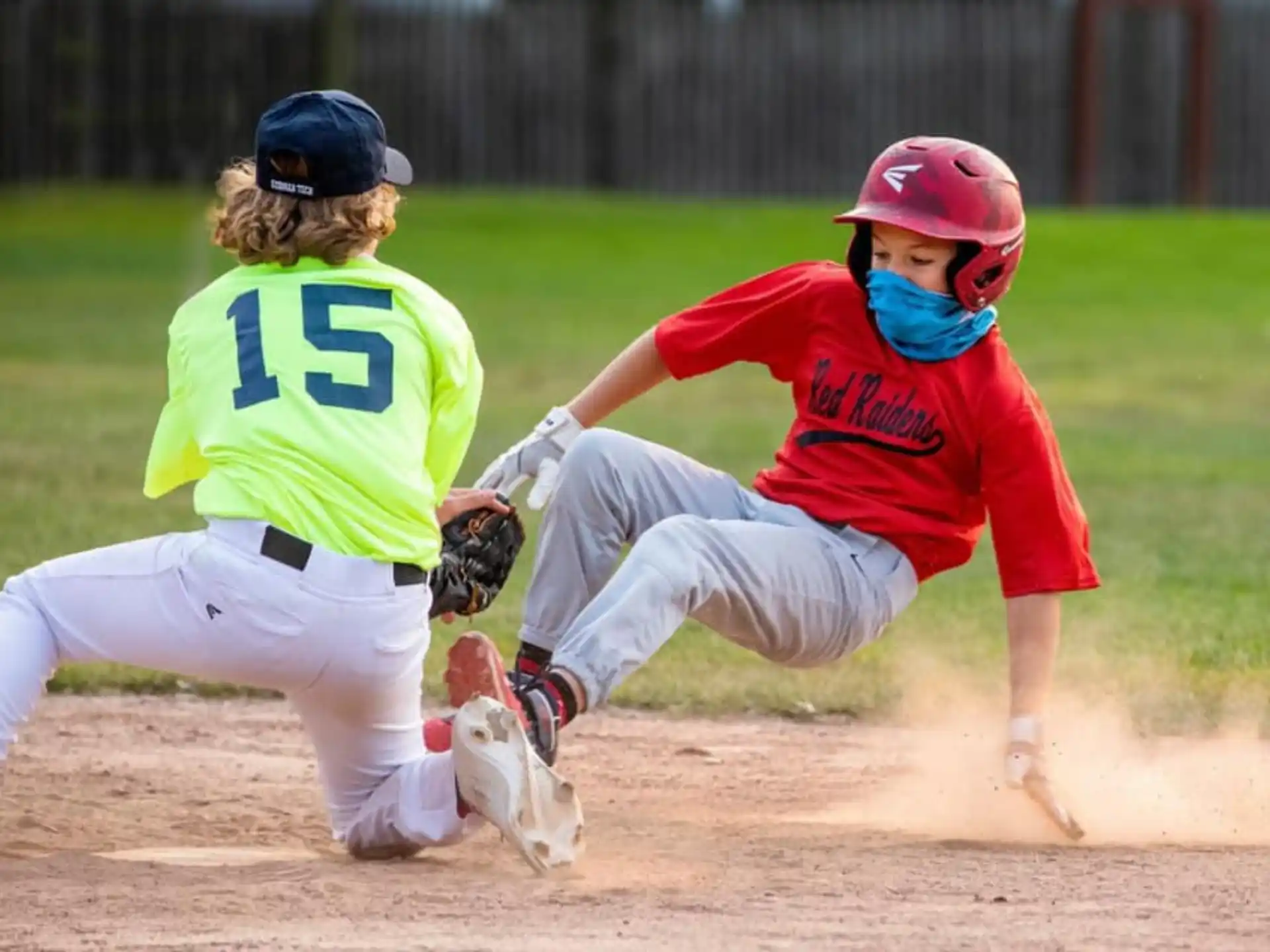 a couple of women playing baseball