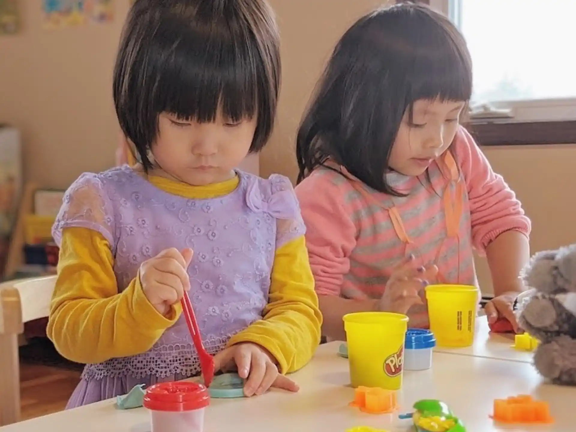 a couple of young girls painting