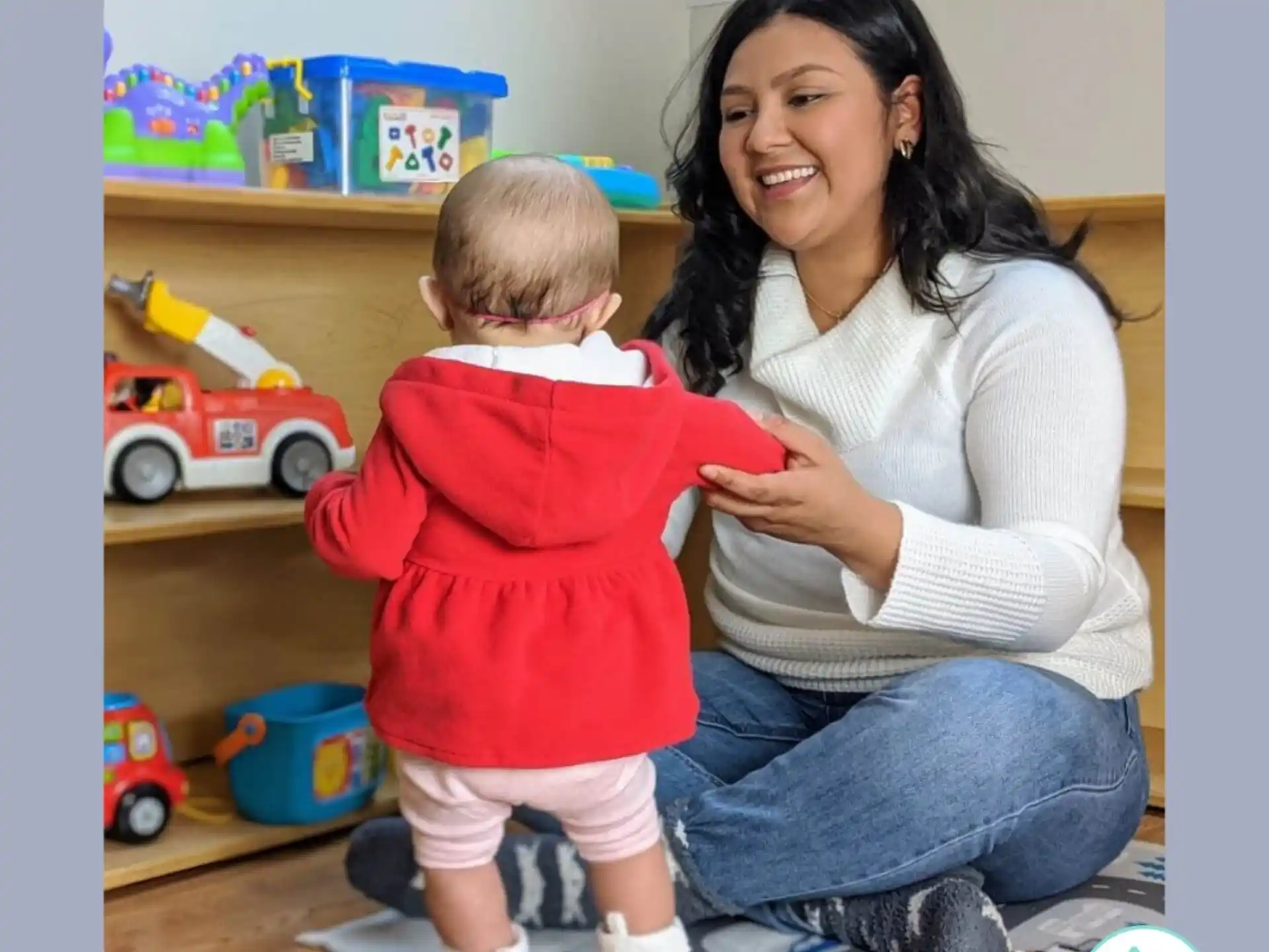 a woman holding a baby