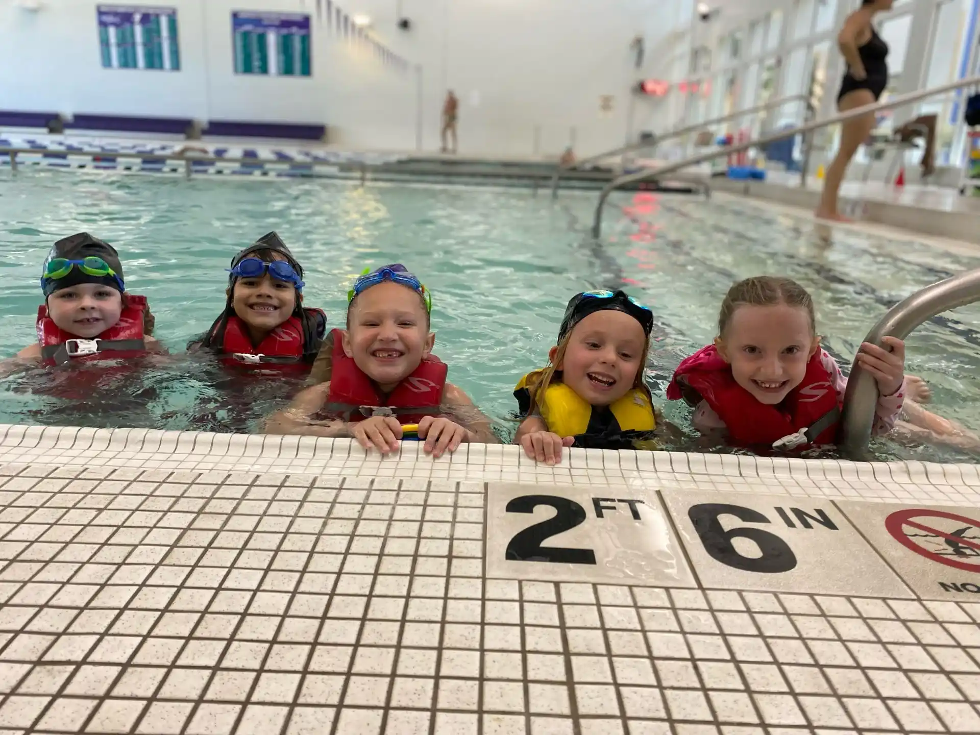 a group of kids in a pool
