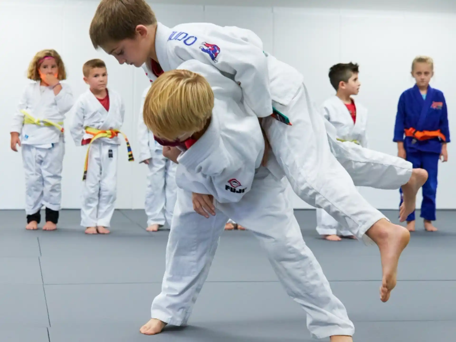 a group of people in karate uniforms