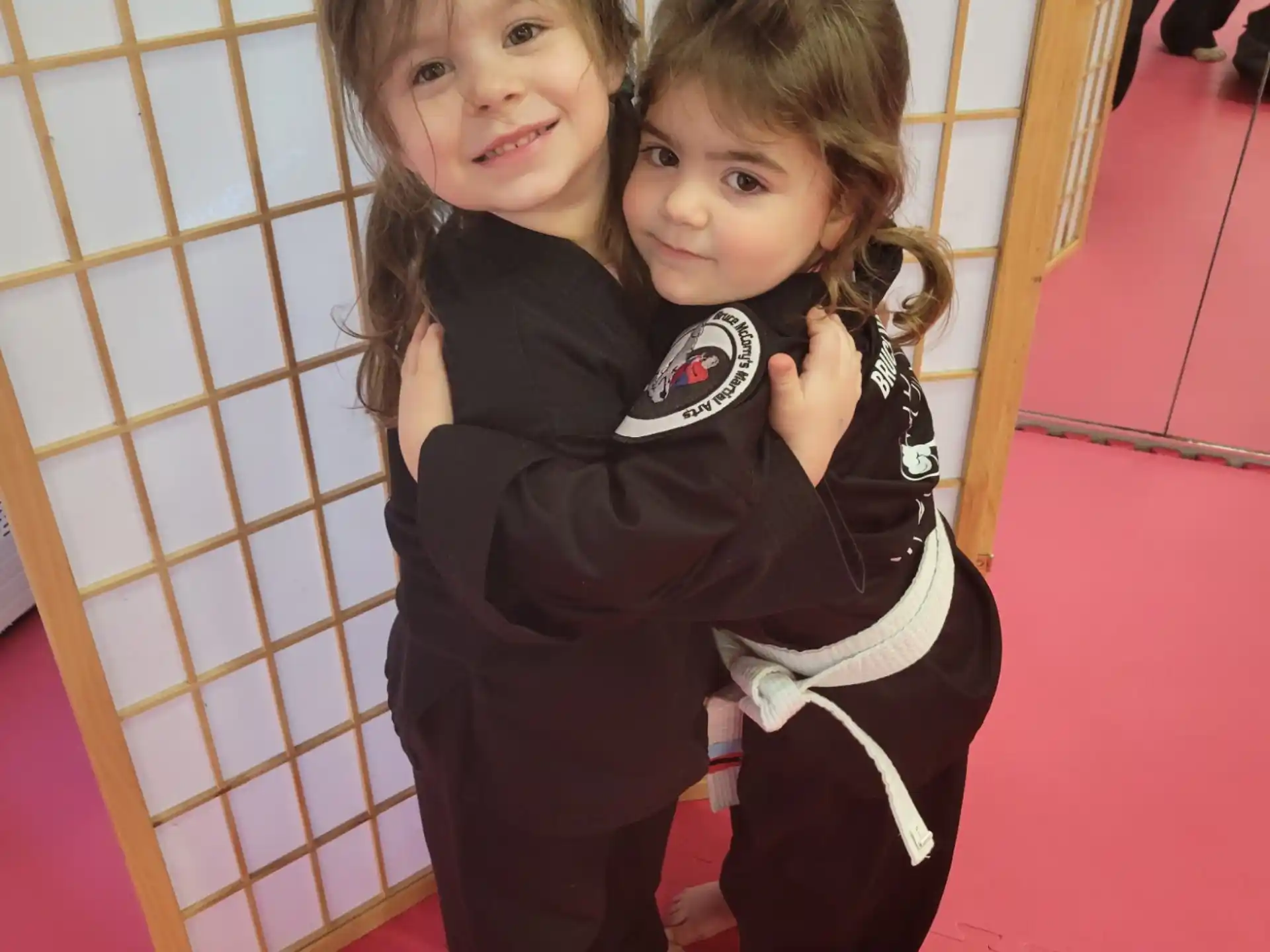a couple of children hugging