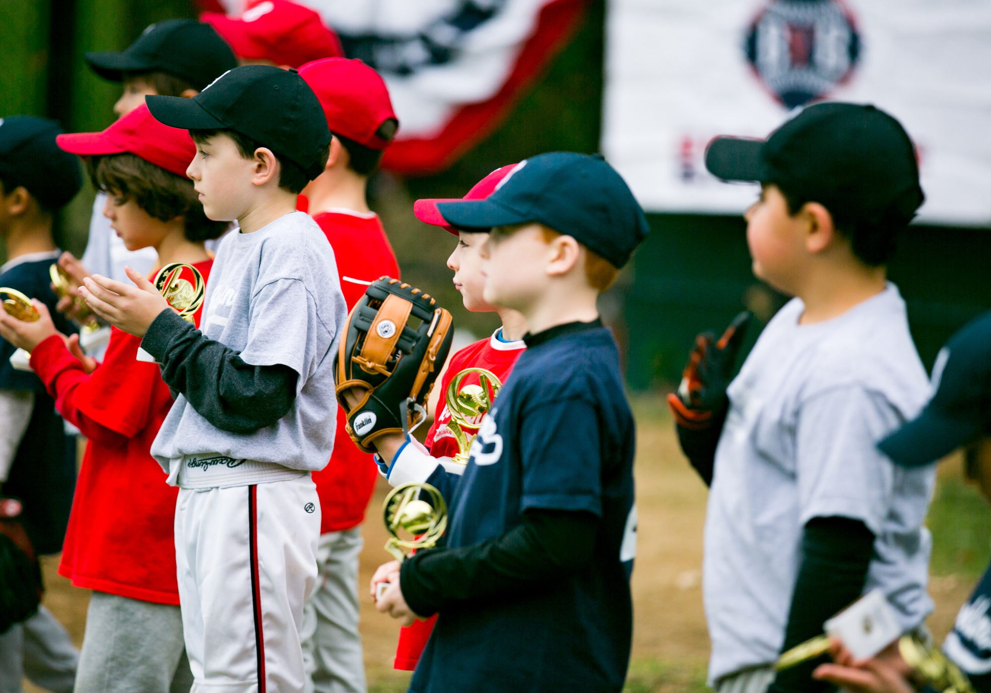 a group of kids in baseball uniforms