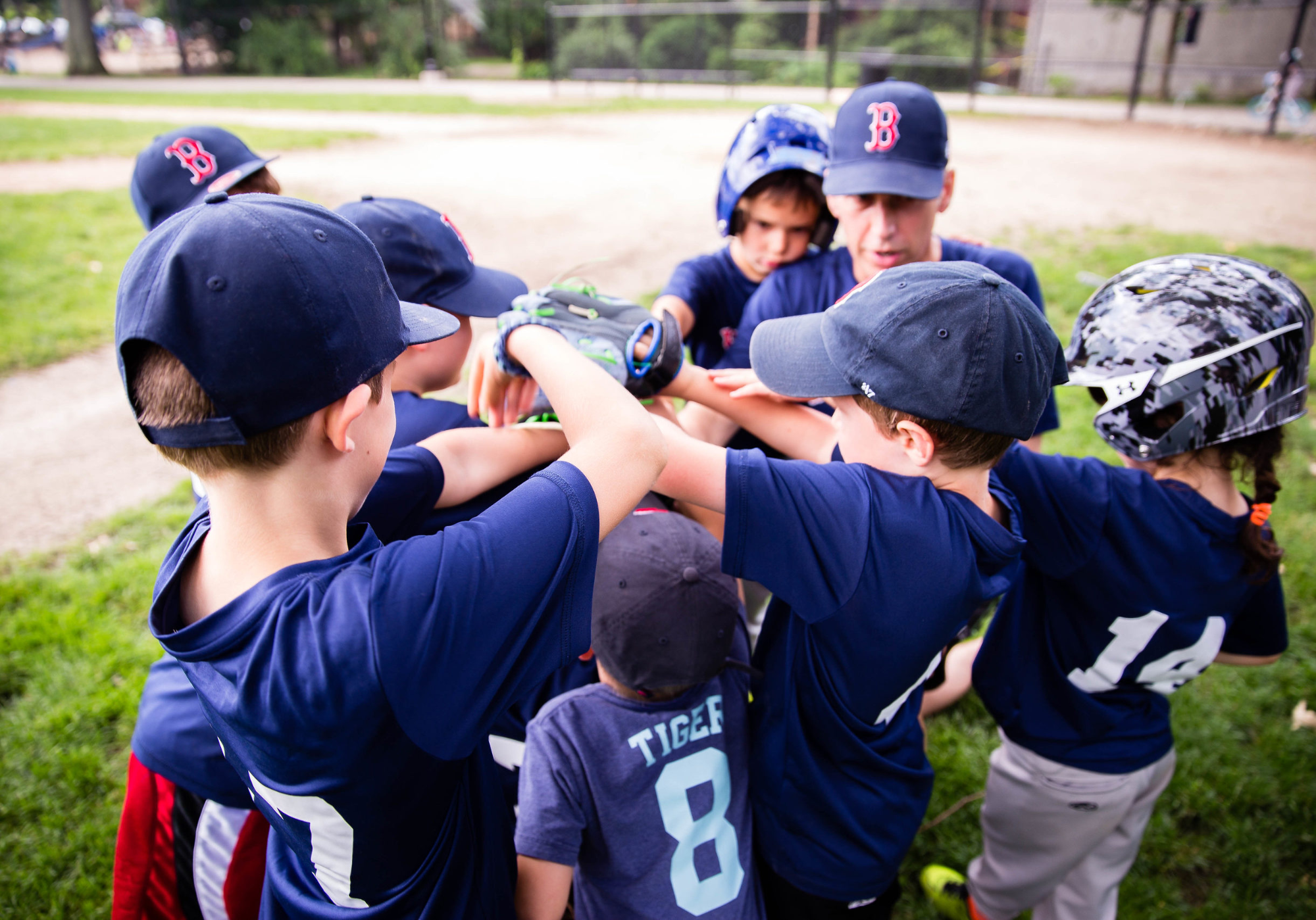 a group of kids in baseball uniforms