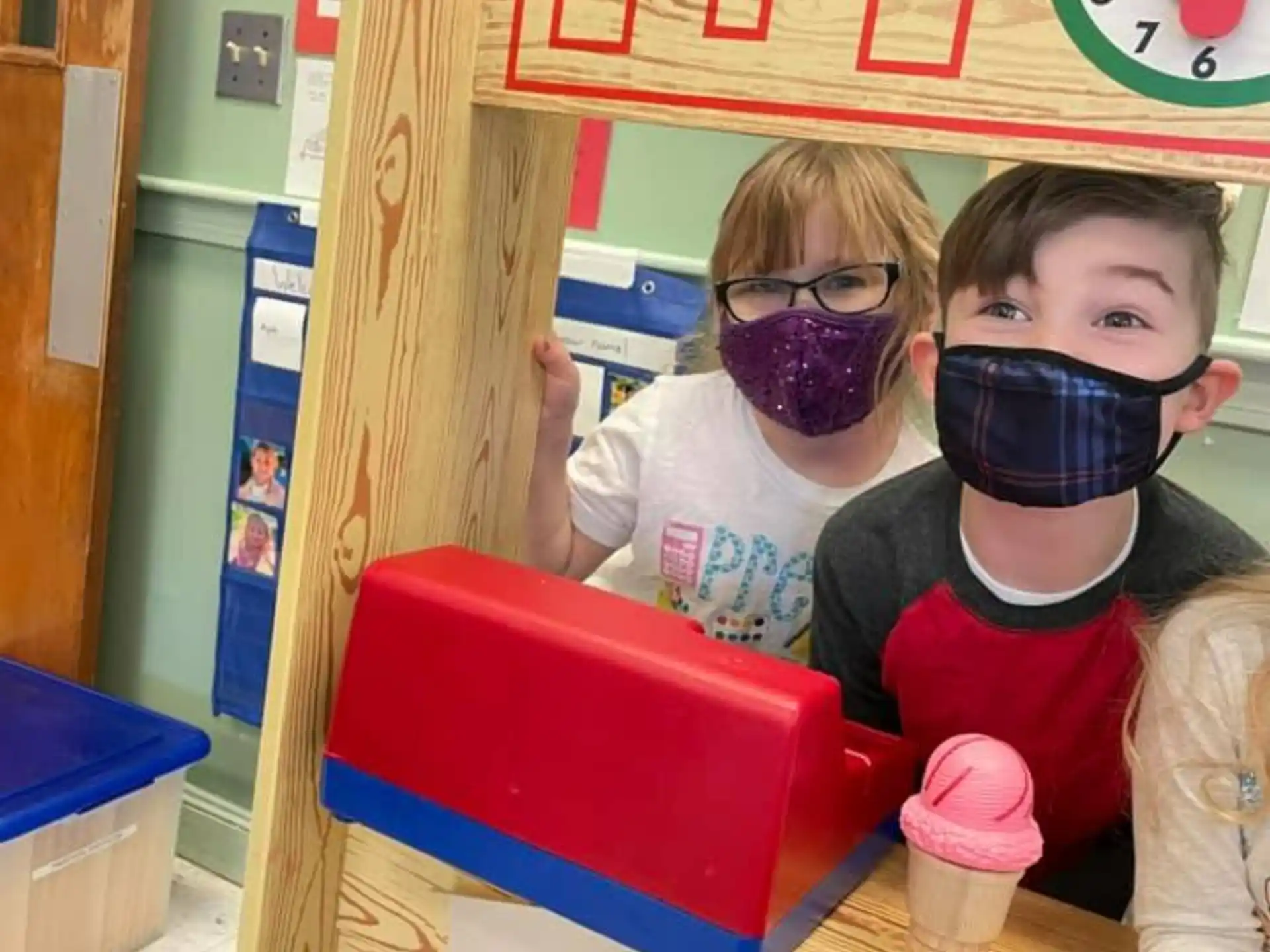 a group of kids wearing masks
