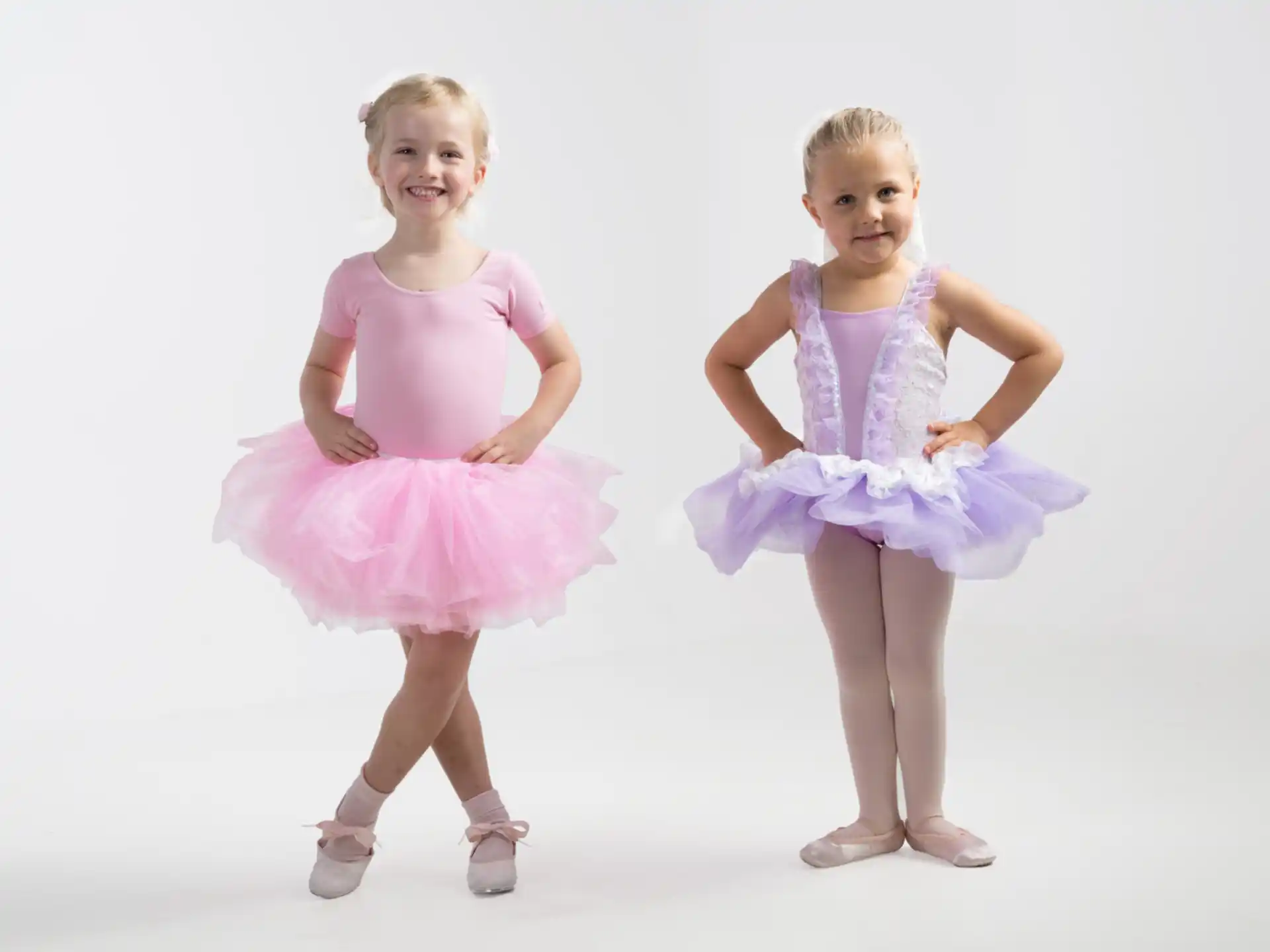 a couple of girls wearing dresses