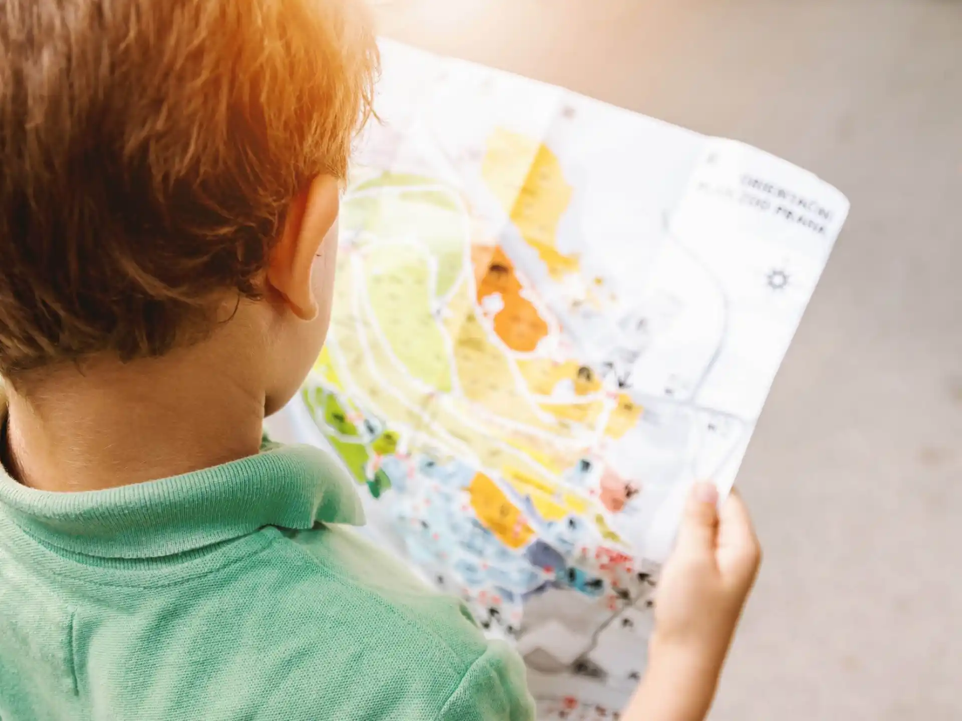 a child looking at a map
