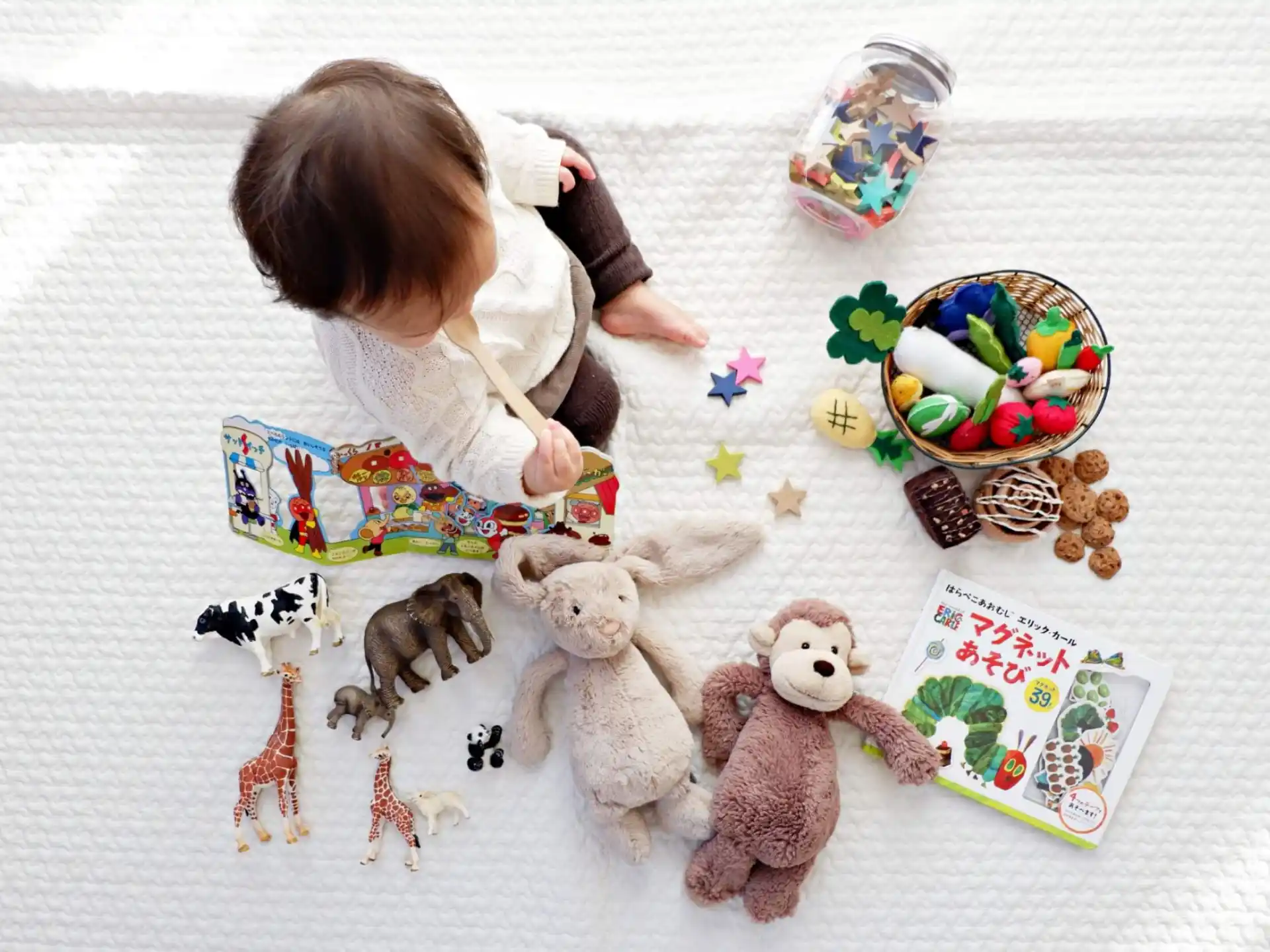 a baby playing with toys