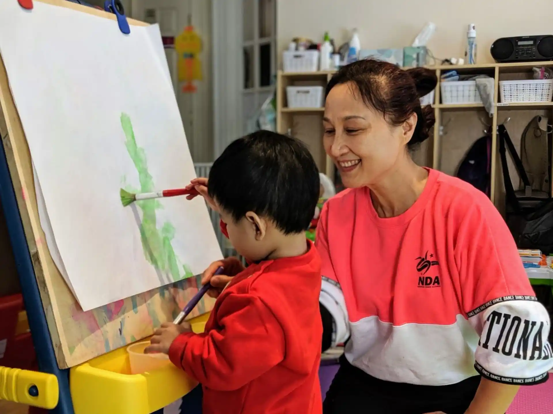 a man and a child painting
