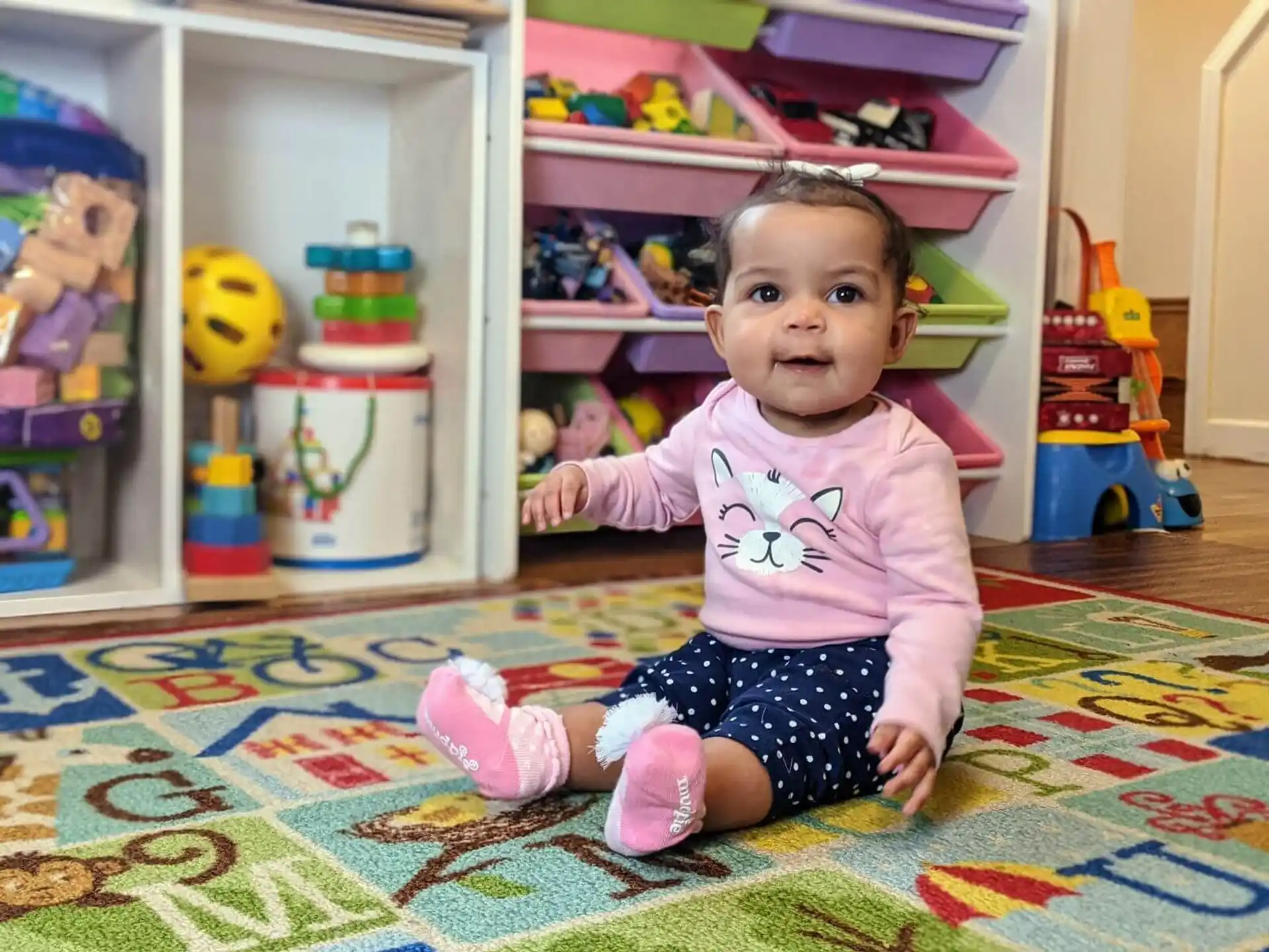 a baby sitting on the floor