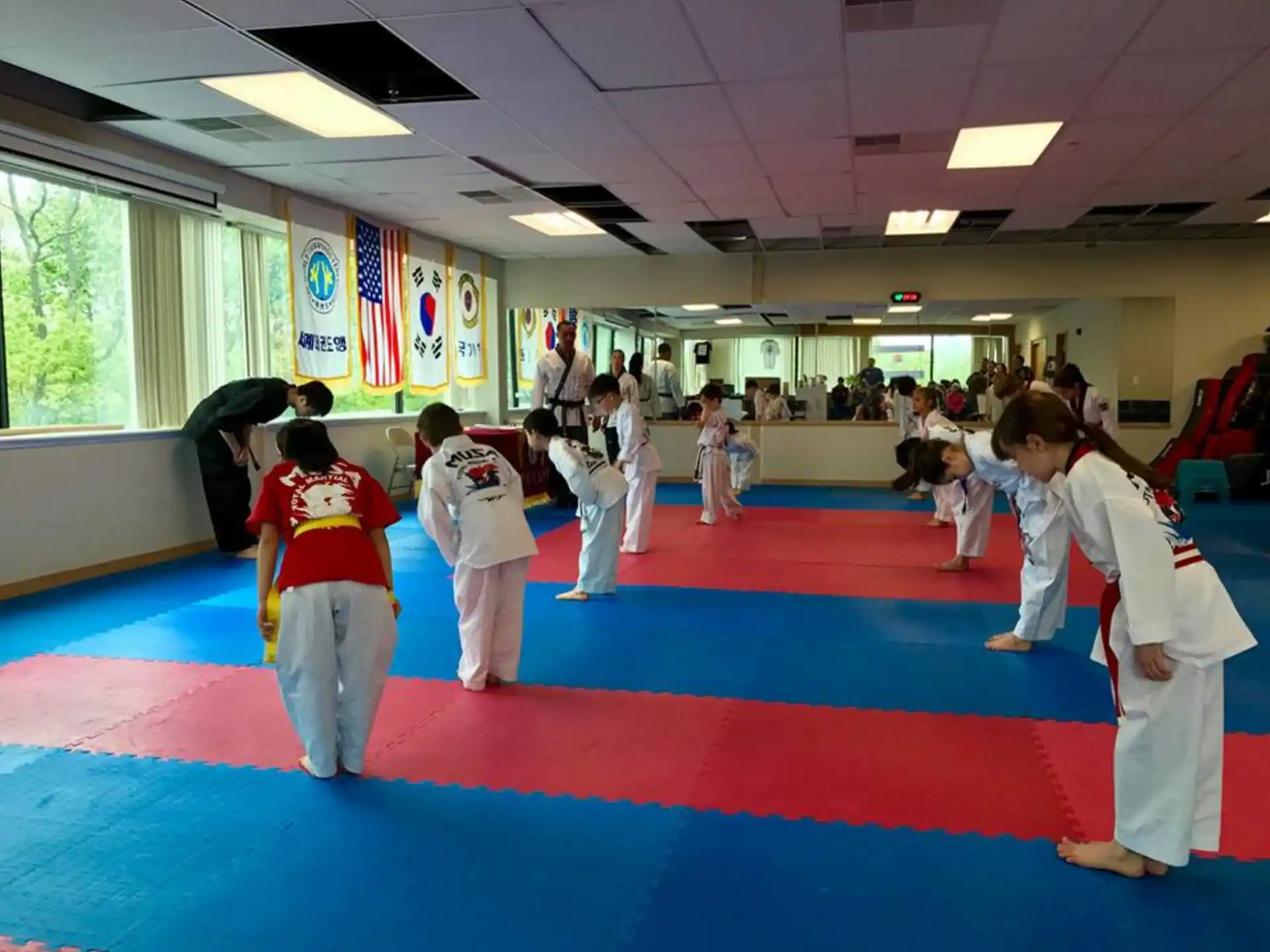 a group of people in a karate class