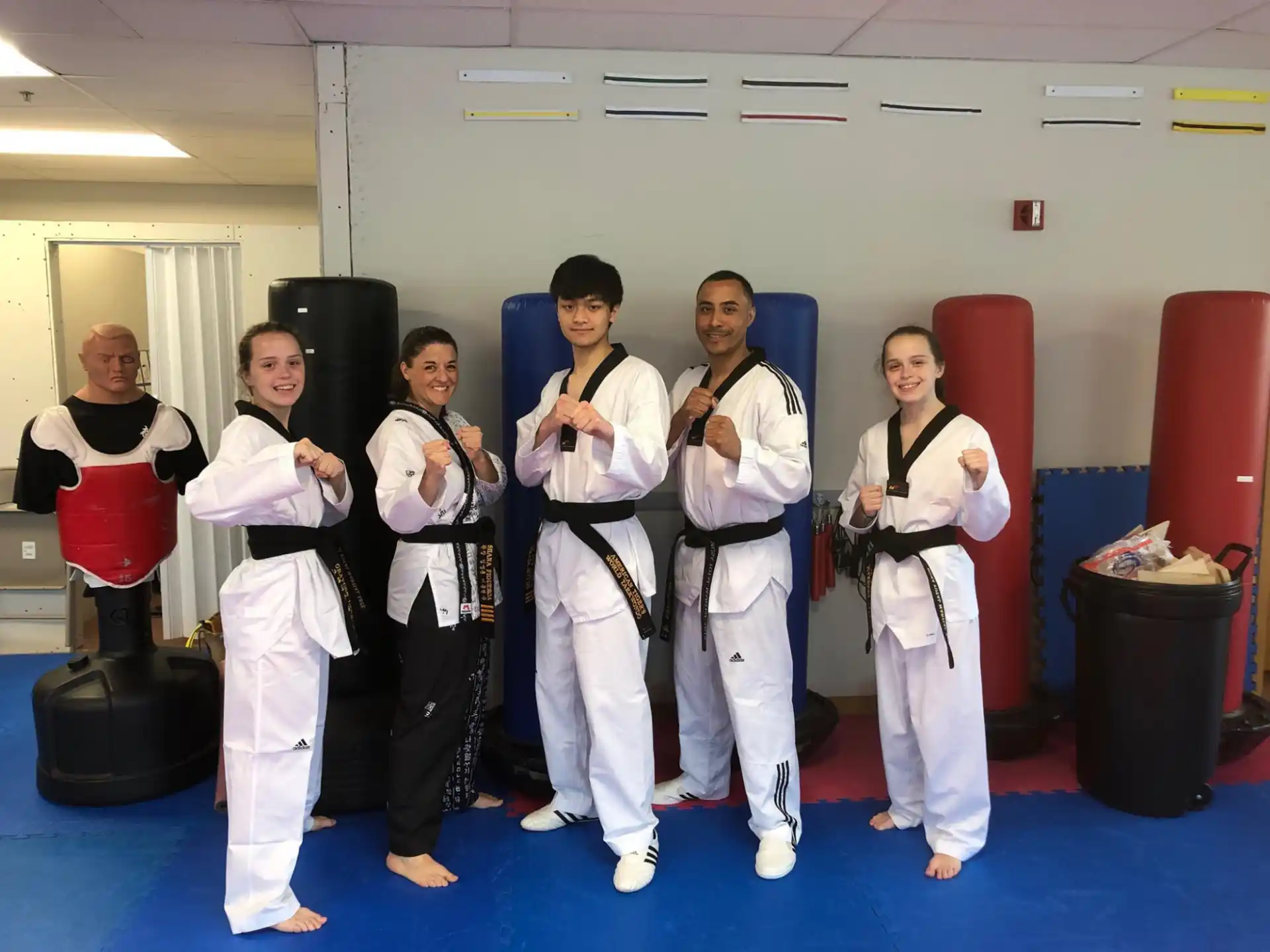 a group of people in karate uniforms