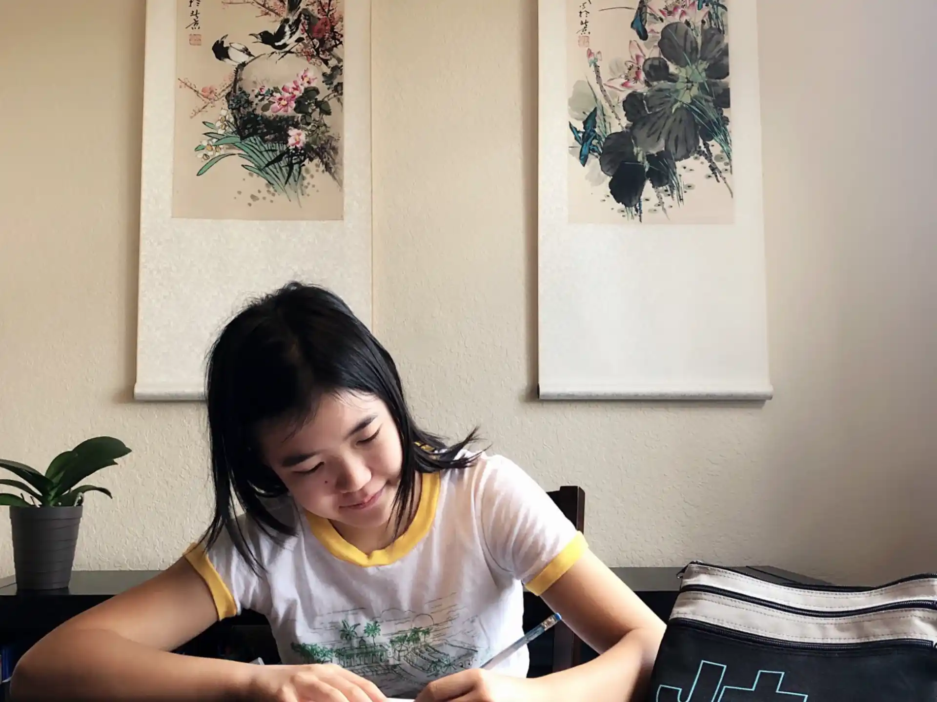 a girl sitting at a table