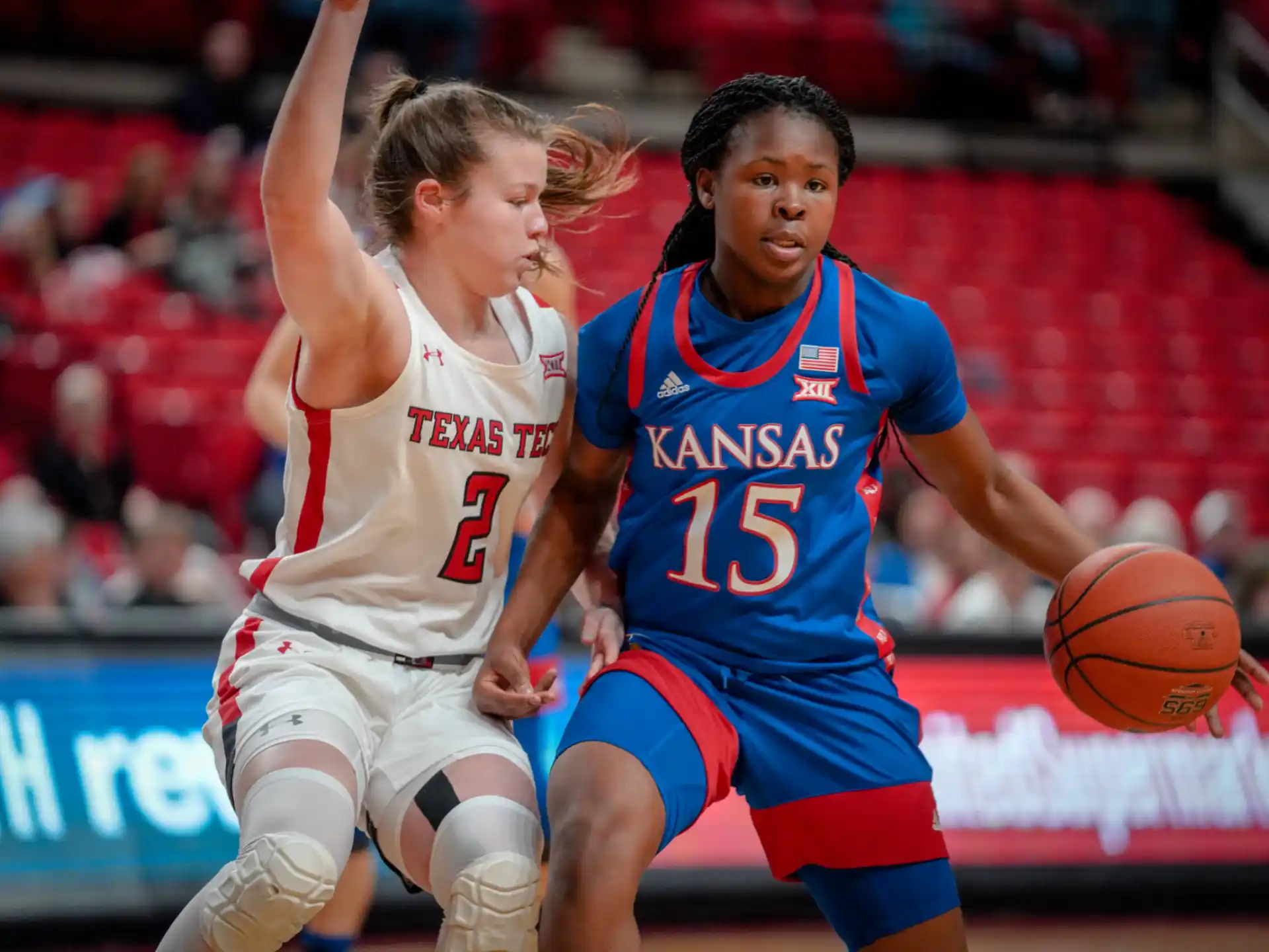 a couple of women playing basketball