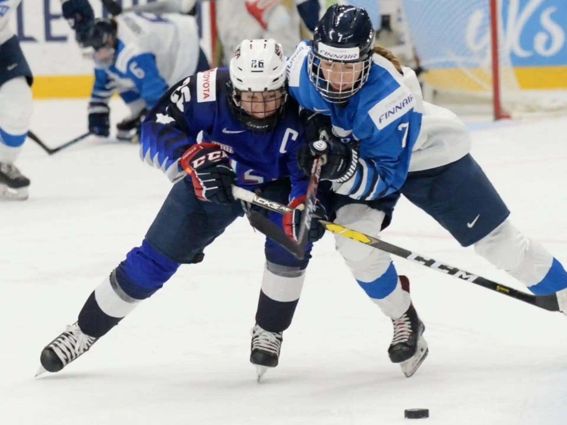 a group of hockey players on ice