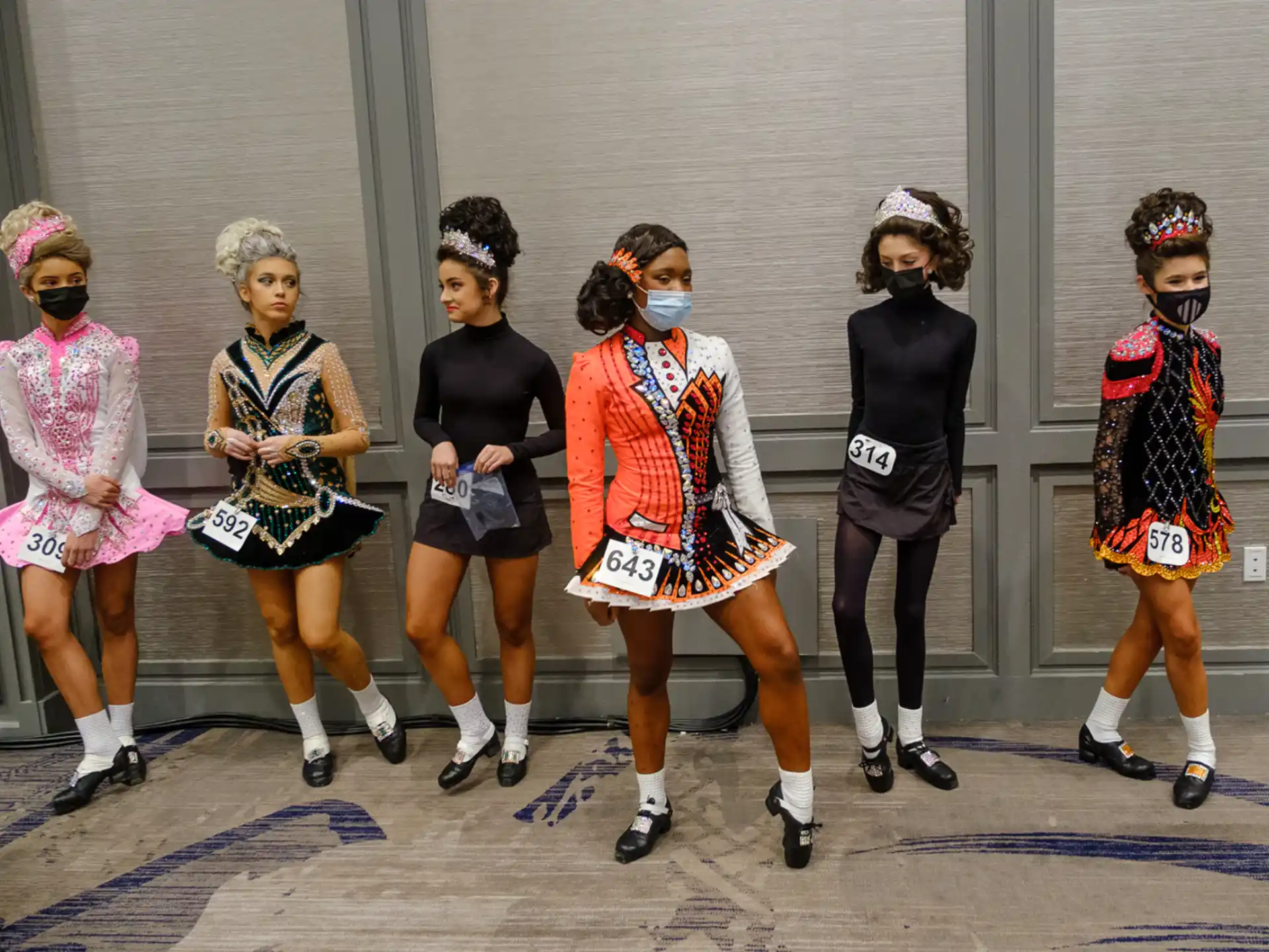 a group of women wearing clothing
