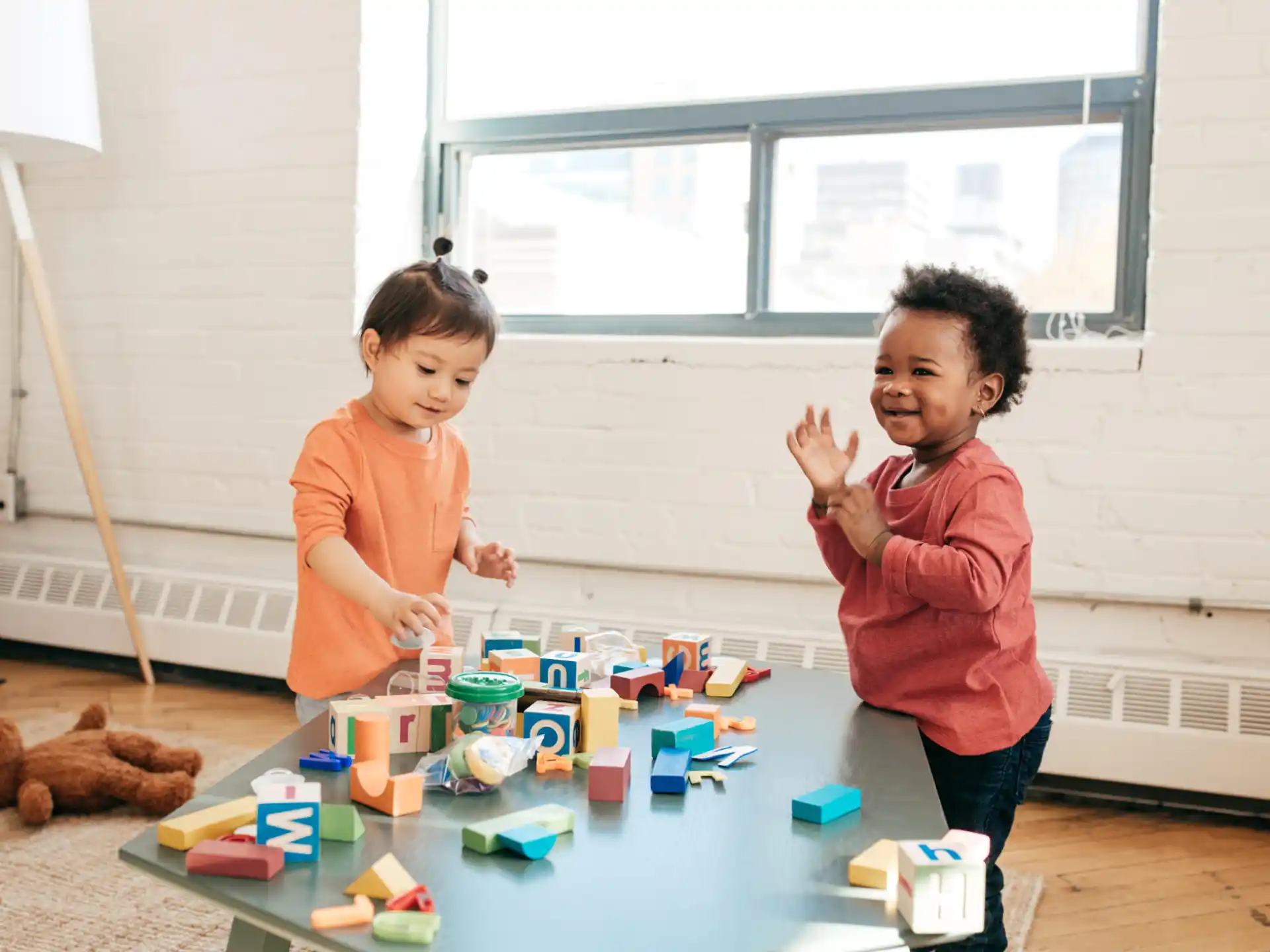 a couple of children playing with toys
