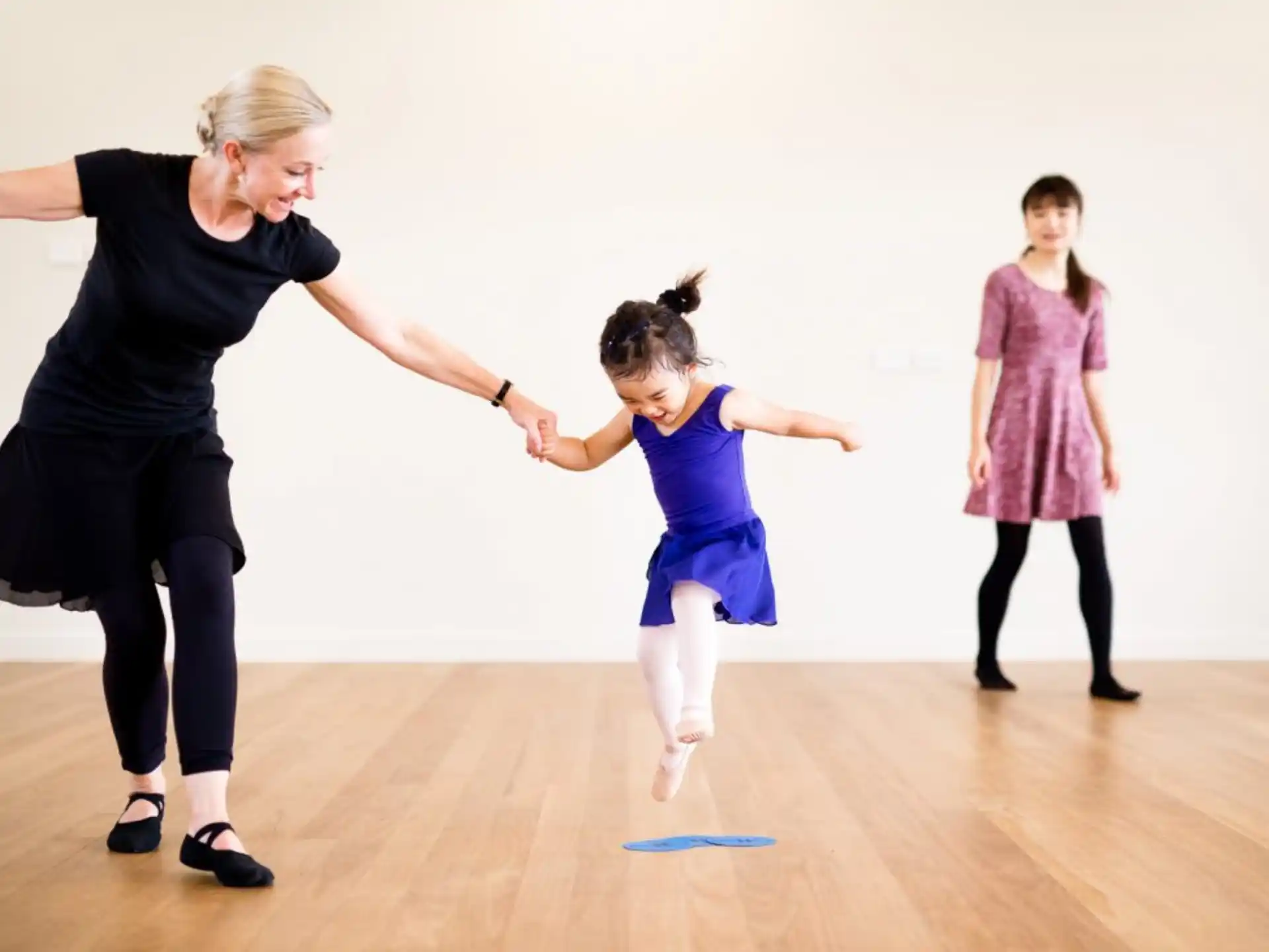 a person and a girl dancing