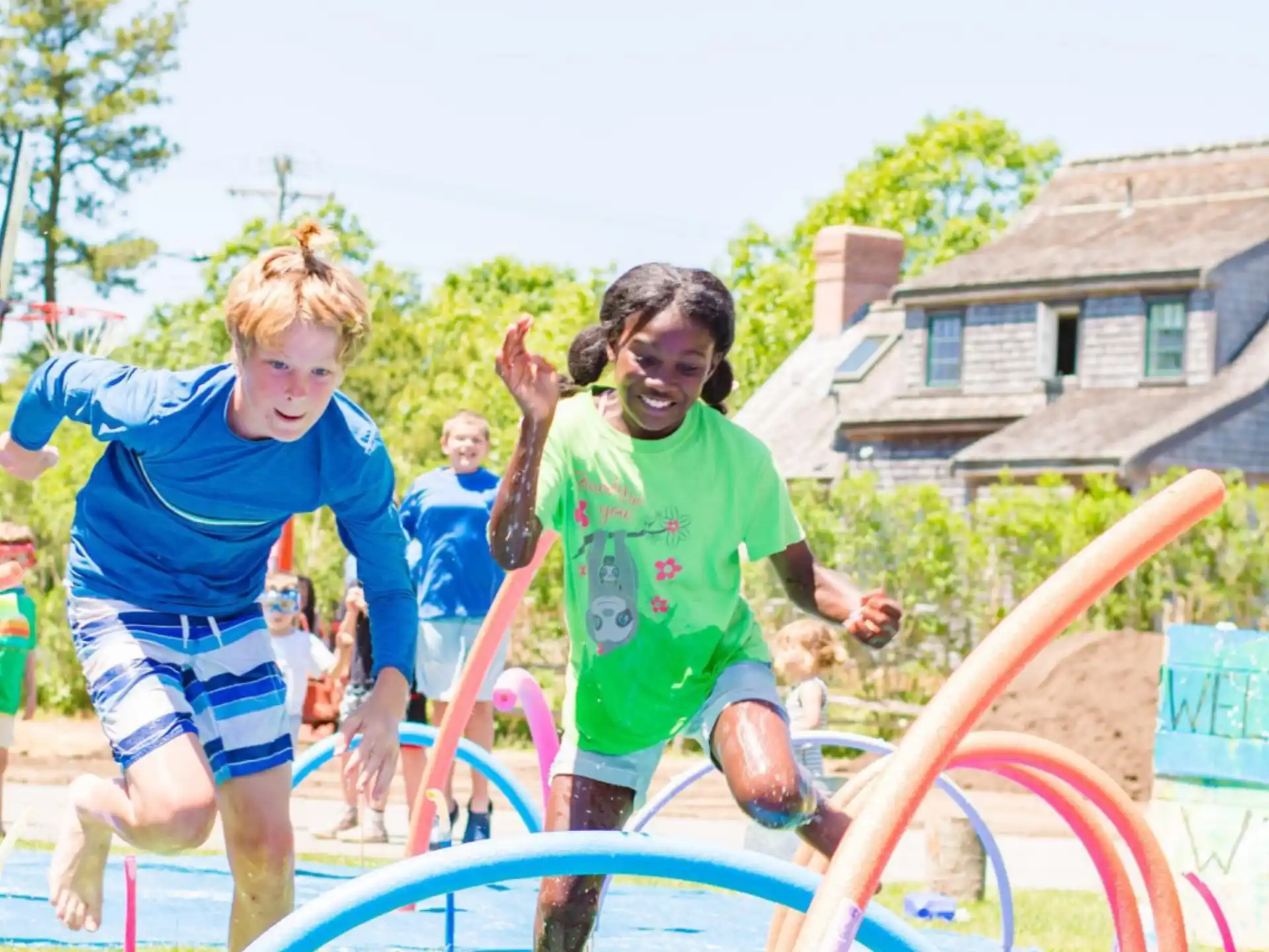 a group of children playing in a playground