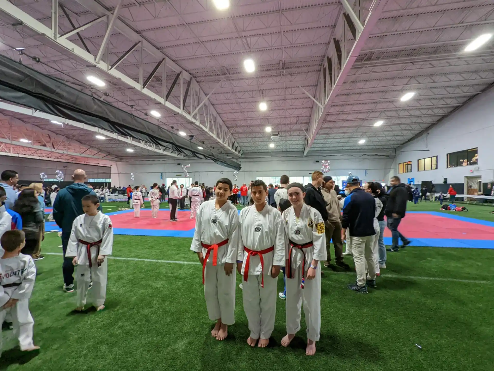 a group of people in karate uniforms