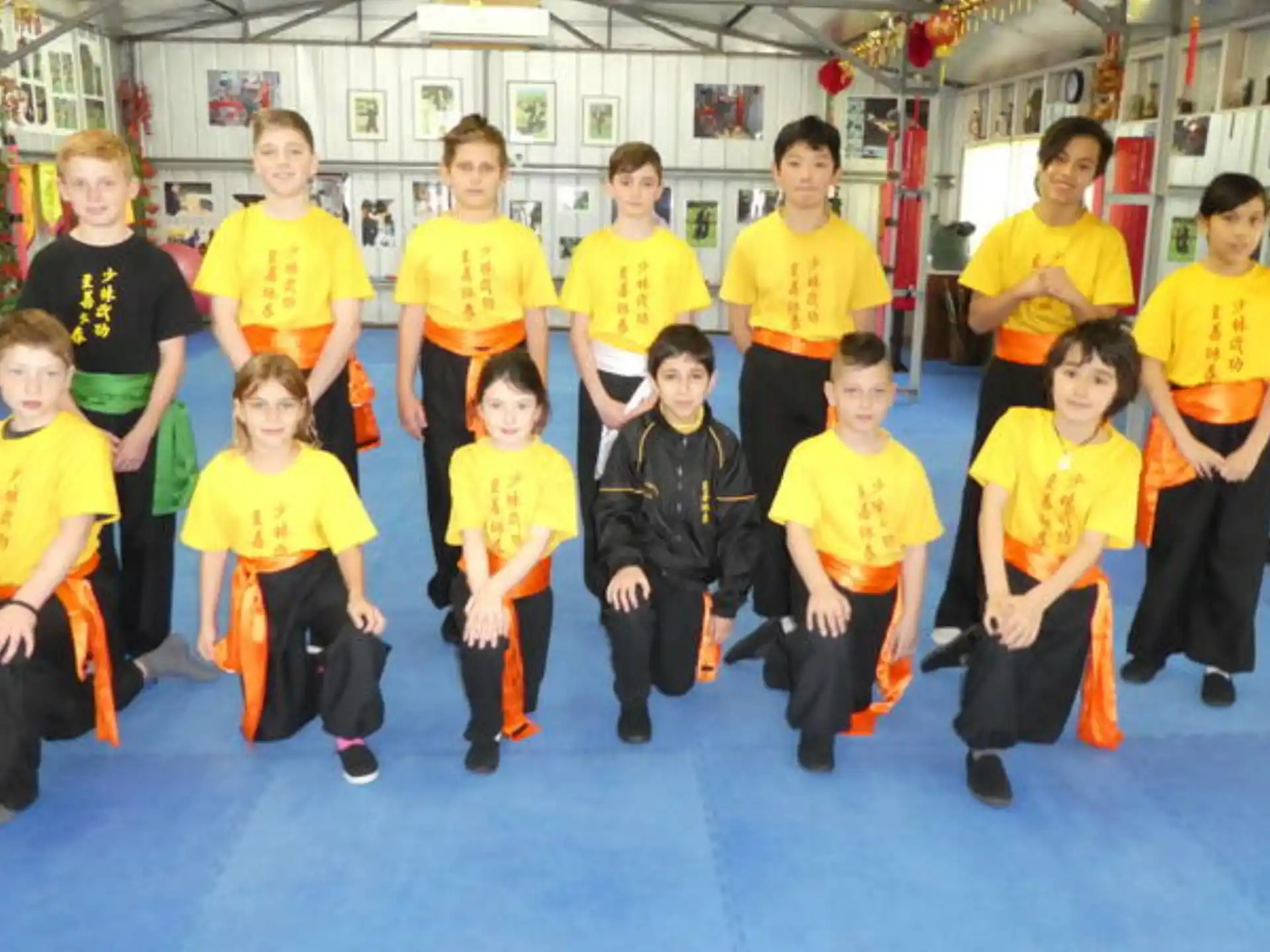 a group of children in yellow t-shirts
