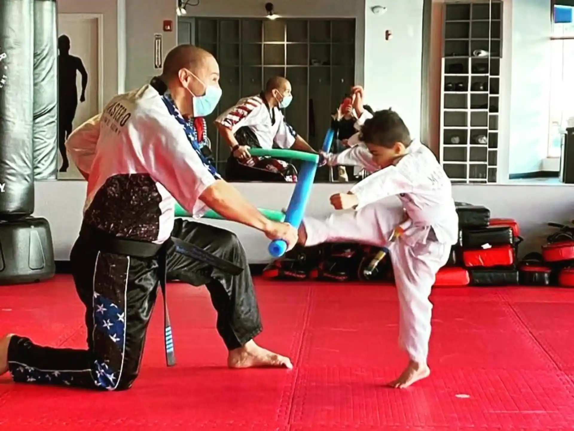 a group of people in karate uniforms