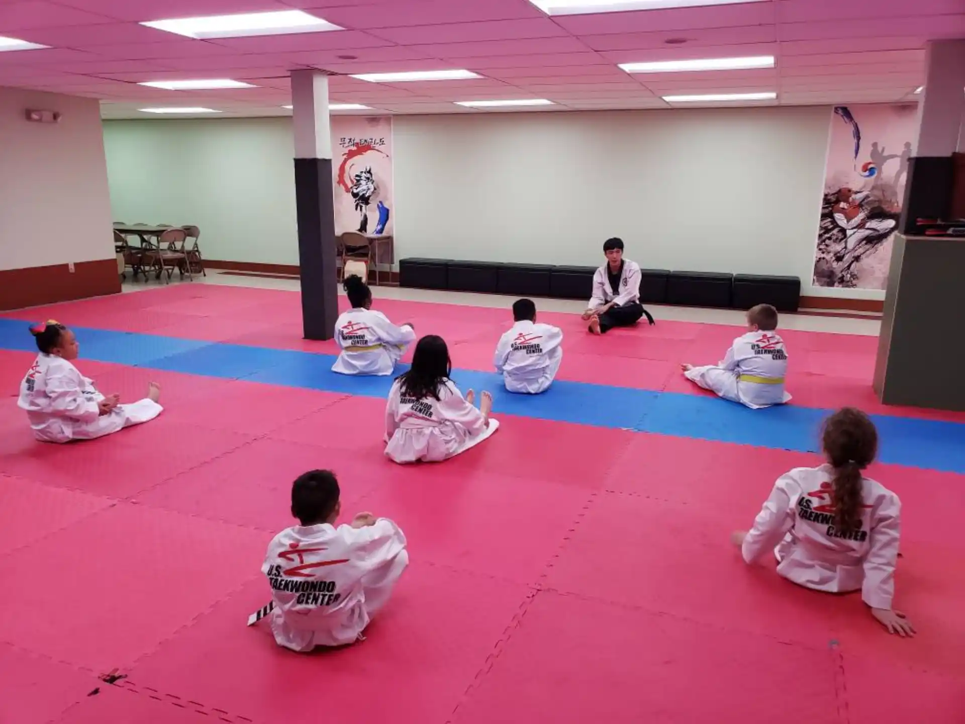 a group of people sitting on the floor