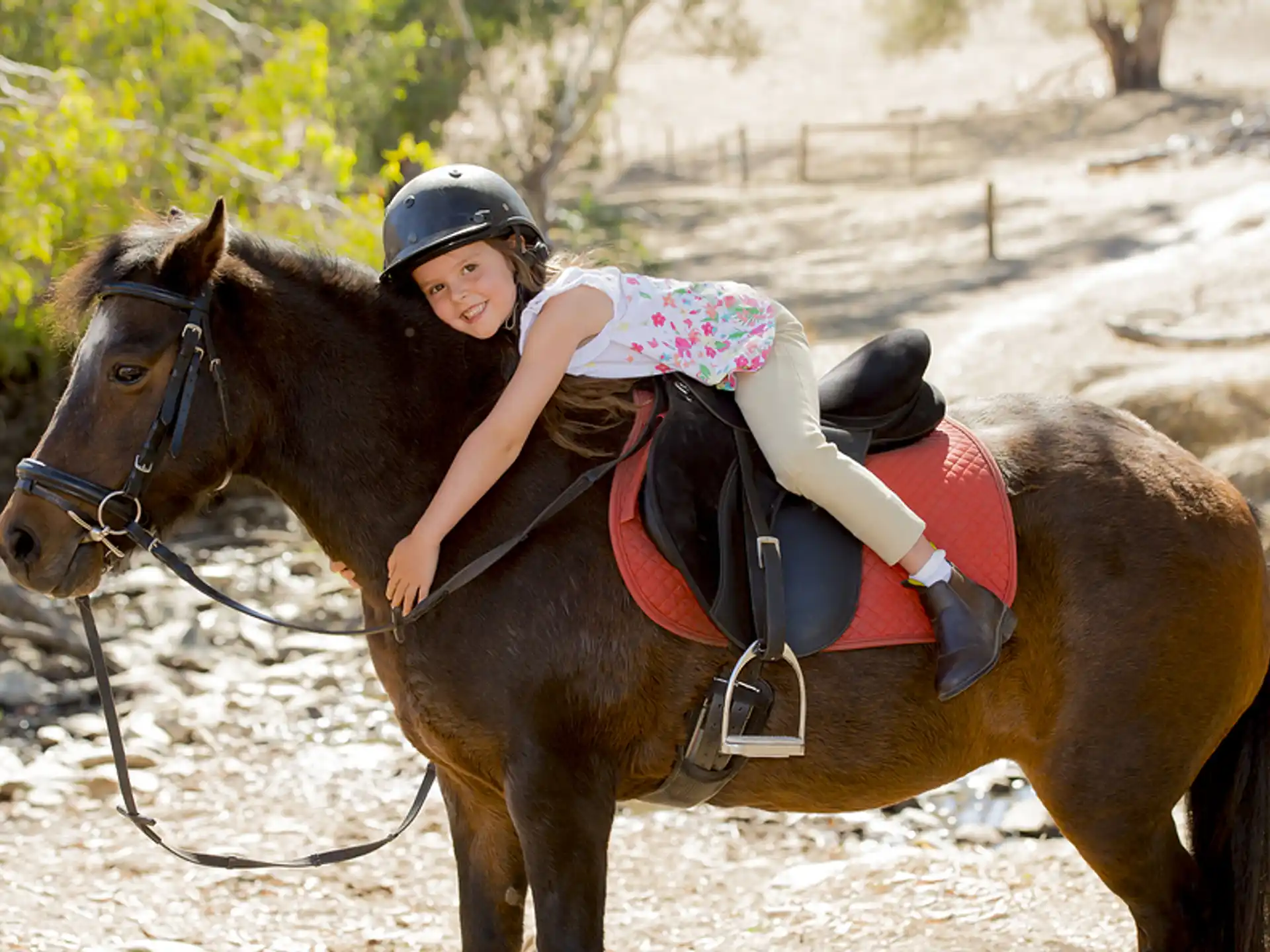 a girl riding a horse