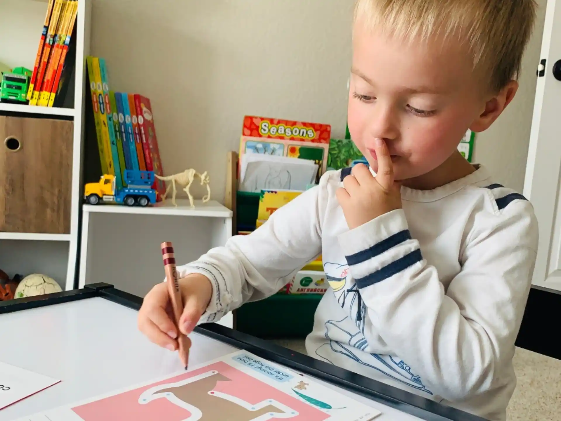 a child drawing on a paper