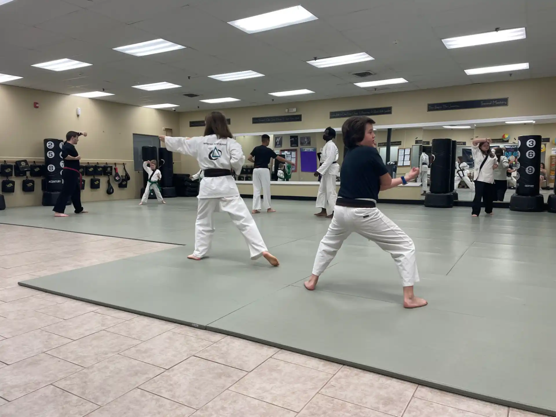 a group of people in karate uniforms