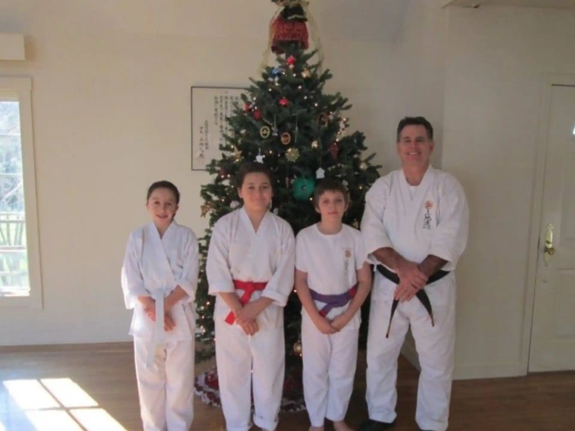 a group of people in karate uniforms