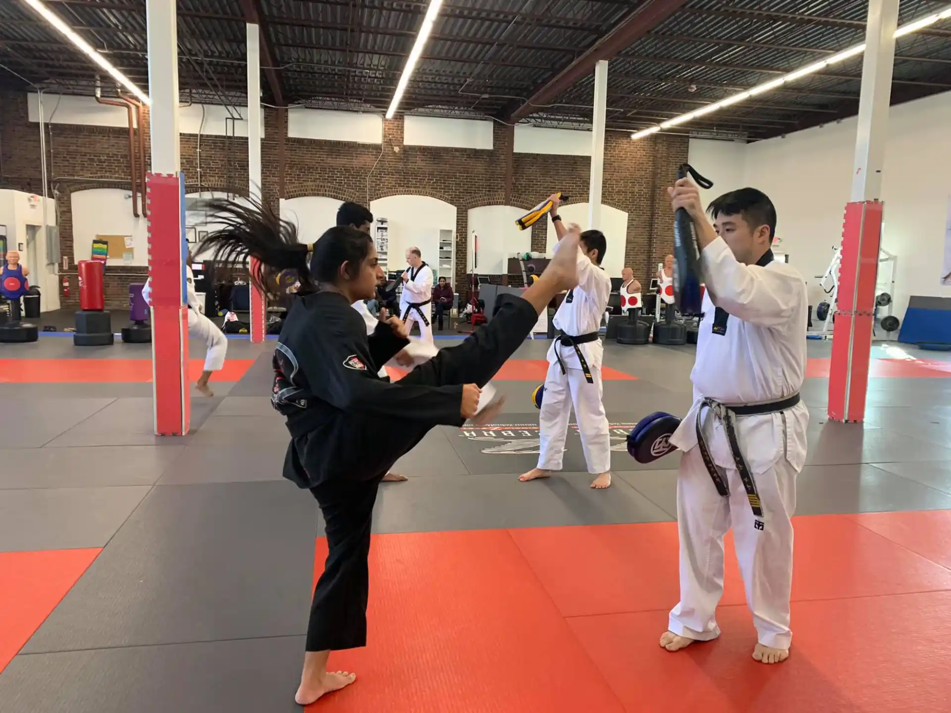 a group of people in karate uniforms