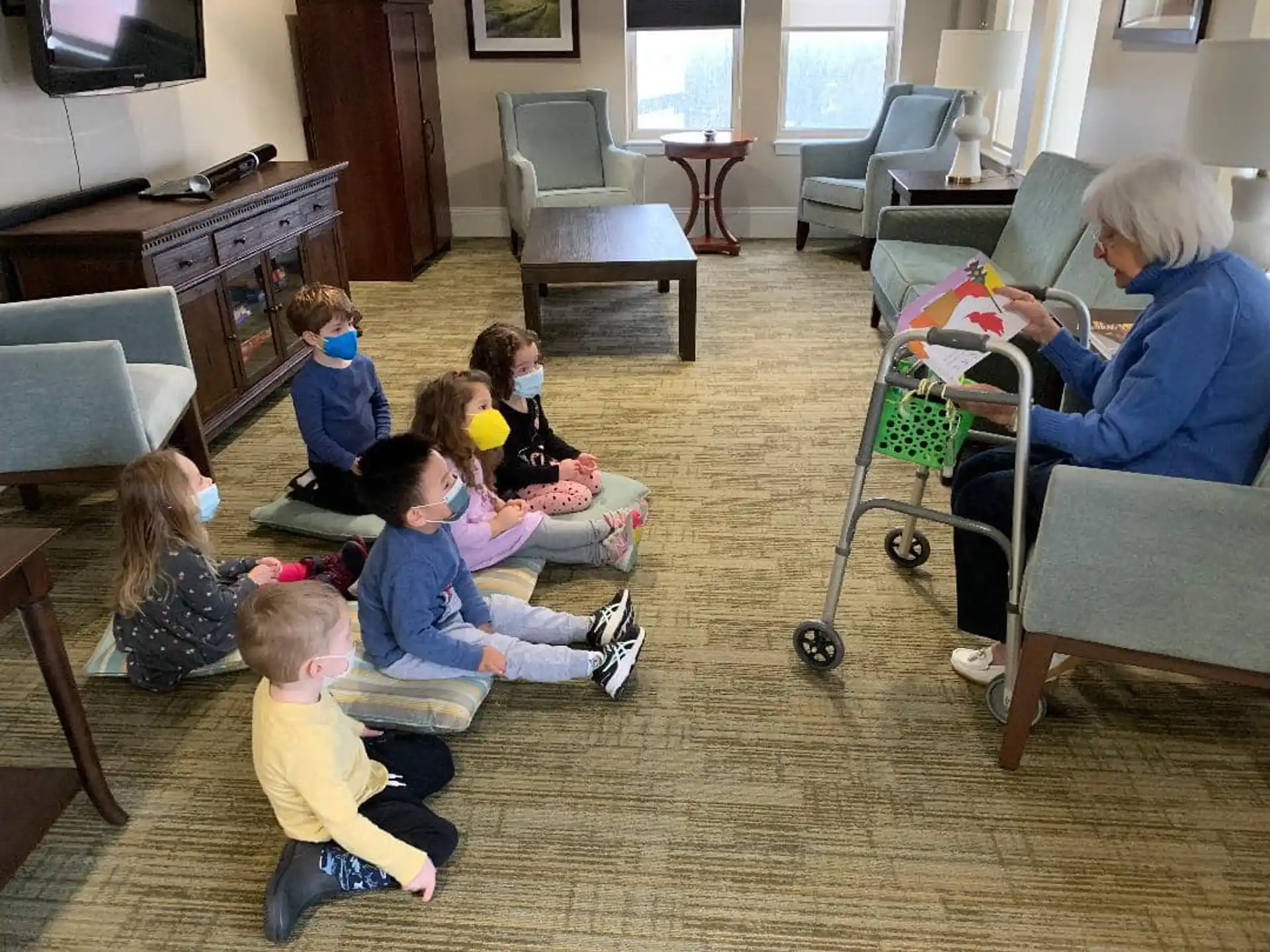 a person and several children in a living room