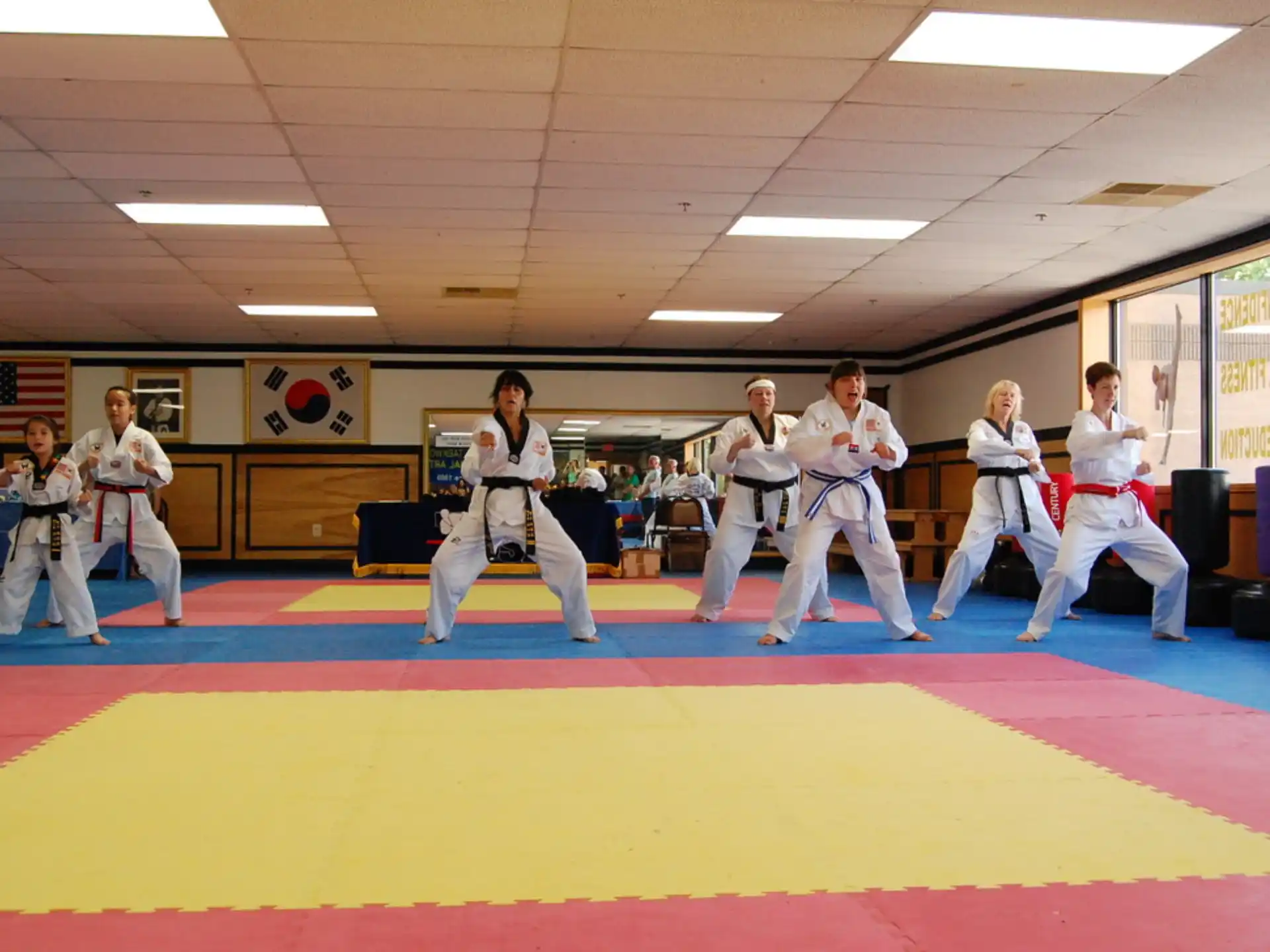 a group of people in karate uniforms